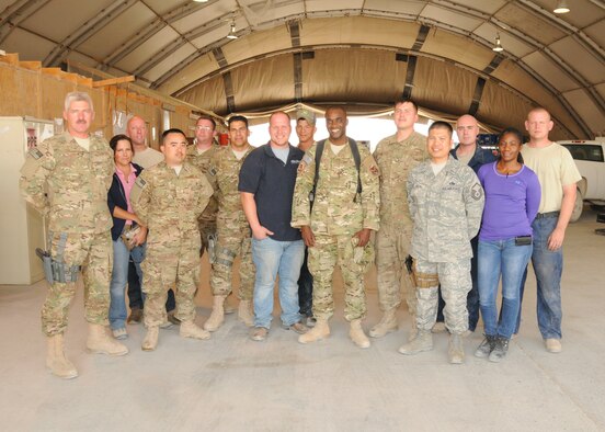 Master Sgt. Stephen Charles, 451st Air Expeditionary Wing ground safety manager, and 451st Air Expeditionary Wing Vehicle Operations and Maintenance personnel, pose for a group photo here at Kandahar Airfield, Afghanistan, May 23, 2012. Charles has worked extensively with the personnel and helped them with their various safety issues. (U.S. Air Force photo/Staff Sgt. Heather Skinkle)