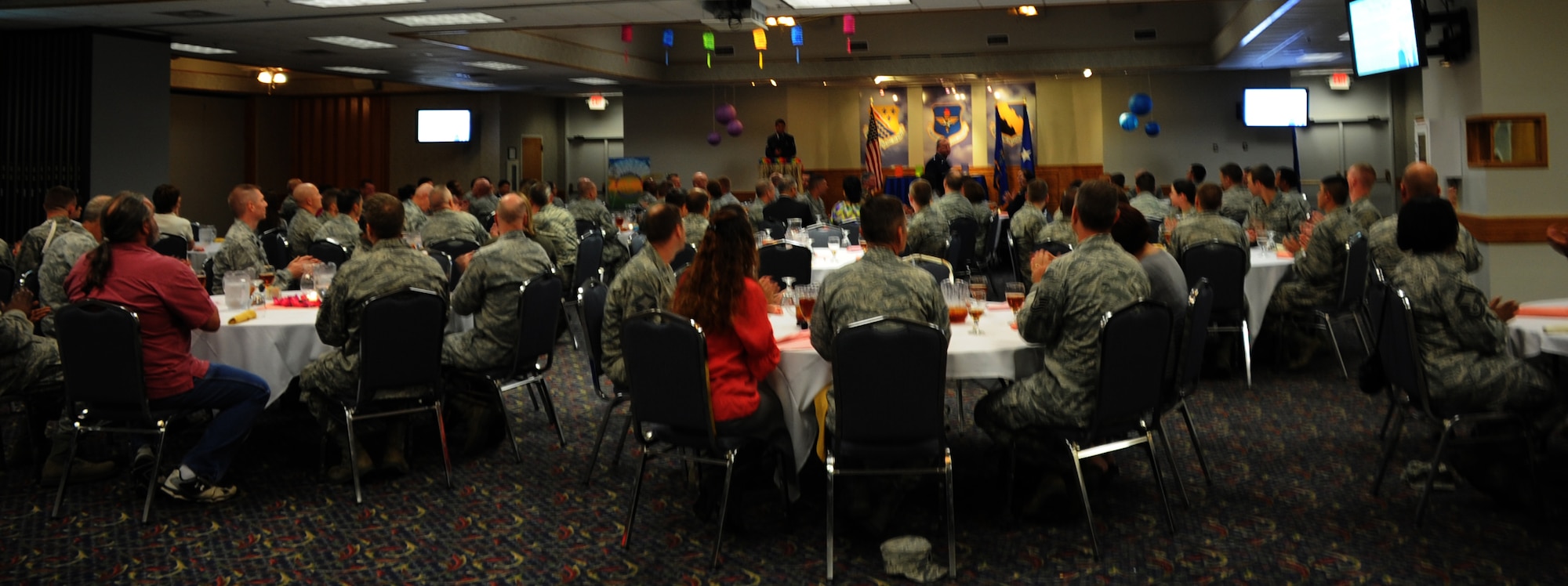 The master of ceremony A1C Gino Pogoy welcomes everyone to the Asian Pacific Heritage Luncheon held at the Sheppard Club on May 31. Over 120 people came to the this year’s event which was  planned by MSgt Marcos Starks of the 372d Training Squadron. (U.S. Air Force Photo/Kimberly Dagdag)