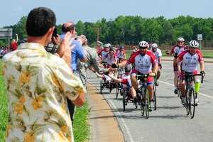 Ride 2 Recovery Memorial Challenge participants pass by Langley Air Force Base, Va., June 1, 2012.  The program is designated a difference in the lives of veterans by assisting their mental and physical rehabilitation programs.  (U.S. Air Force photo by Airman 1st Kayla Newman/Released) 