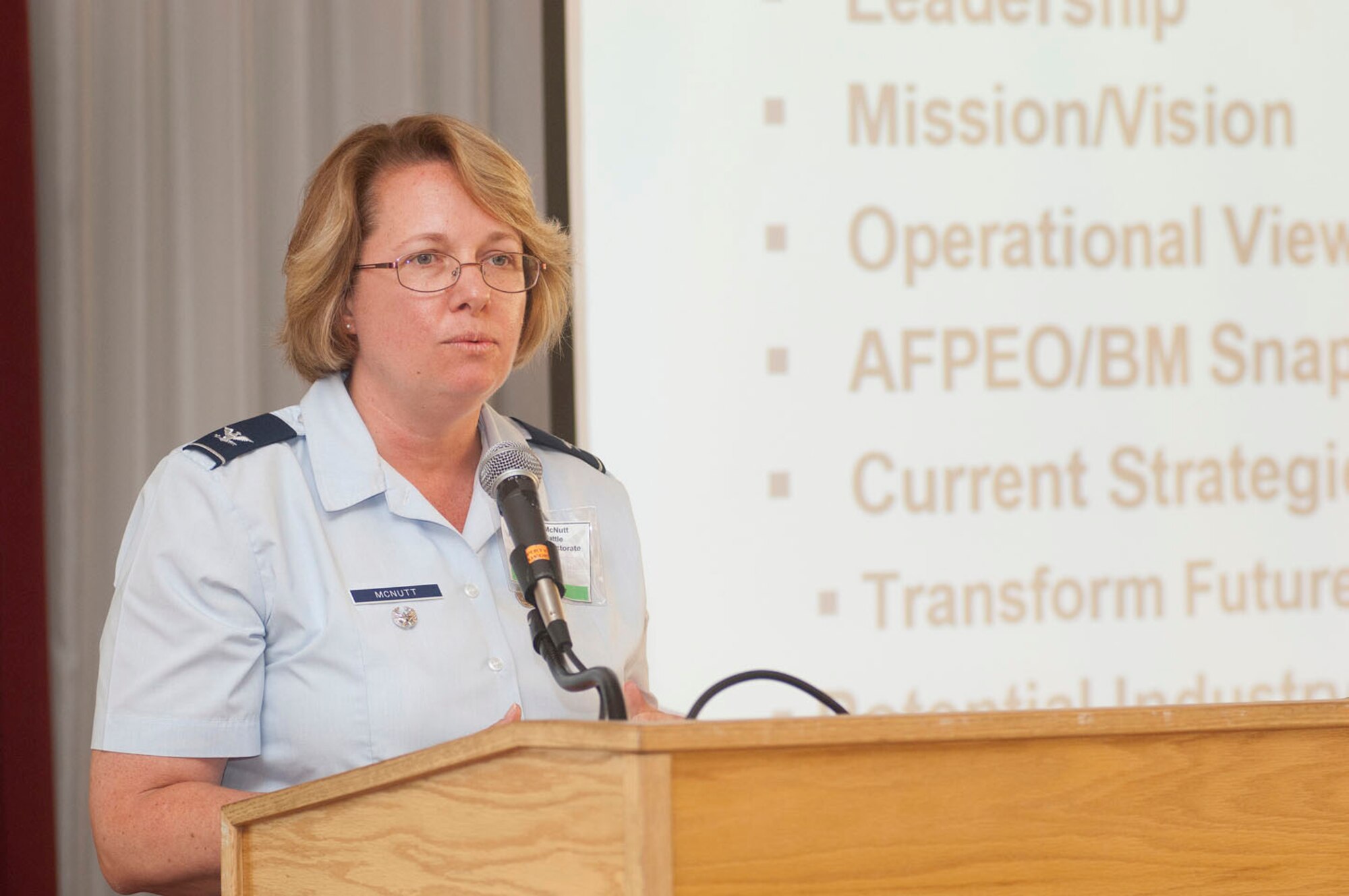 HANSCOM AIR FORCE BASE, Mass. - Col. Stacy McNutt, Battle Management director, provides an update on the directorate's programs and anticipated contract actions to members of the Hanscom Representatives Association at the group's month luncheon meeting June 9, 2011 at the Minuteman Club. Col. McNutt took over as Battle Management director when Col. Roger Thrasher moved on to a new Pentagon assignment in April. (U.S. Air Force photo by Mark Wyatt)