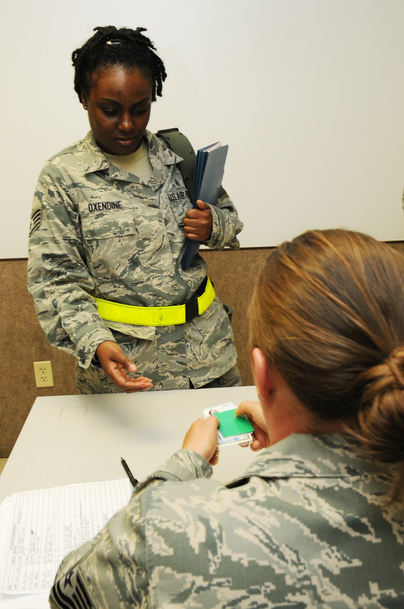Staff Sgt. Wardrecka Oxendine, 927th Aeromedical Staging Squadron, is cleared to enter the final briefing of a mobility exercise sponsored by the 927th Air Refueling Wing June 2, 2012 at MacDill Air Force Base, Fla.  The exercise ensured Oxendine had all the proper paperwork in place in case she needs to deploy, including up-to-date insurance paperwork, identification cards, and dog tags.  