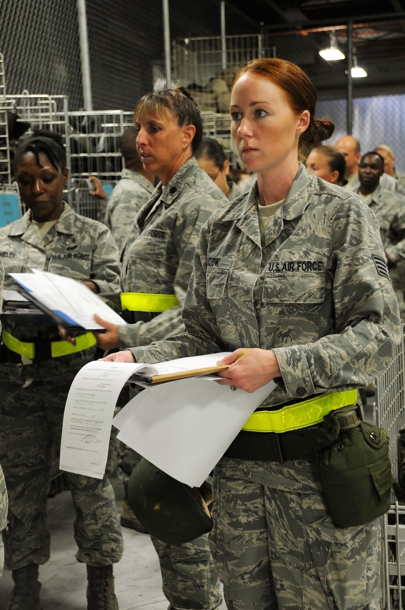 Staff Sgt. Nikki Cook, 927th Aeromedical Staging Squadron, awaits a final look-over of her paperwork after processing through a mobility line March 2, 2012 at MacDill Air Force Base, Fla.  Staff Sgt. Cook, a reservist with the 927th Air Refueling Wing, participated in a mobility exercise designed to simulate the experience of preparing for a deployment. 