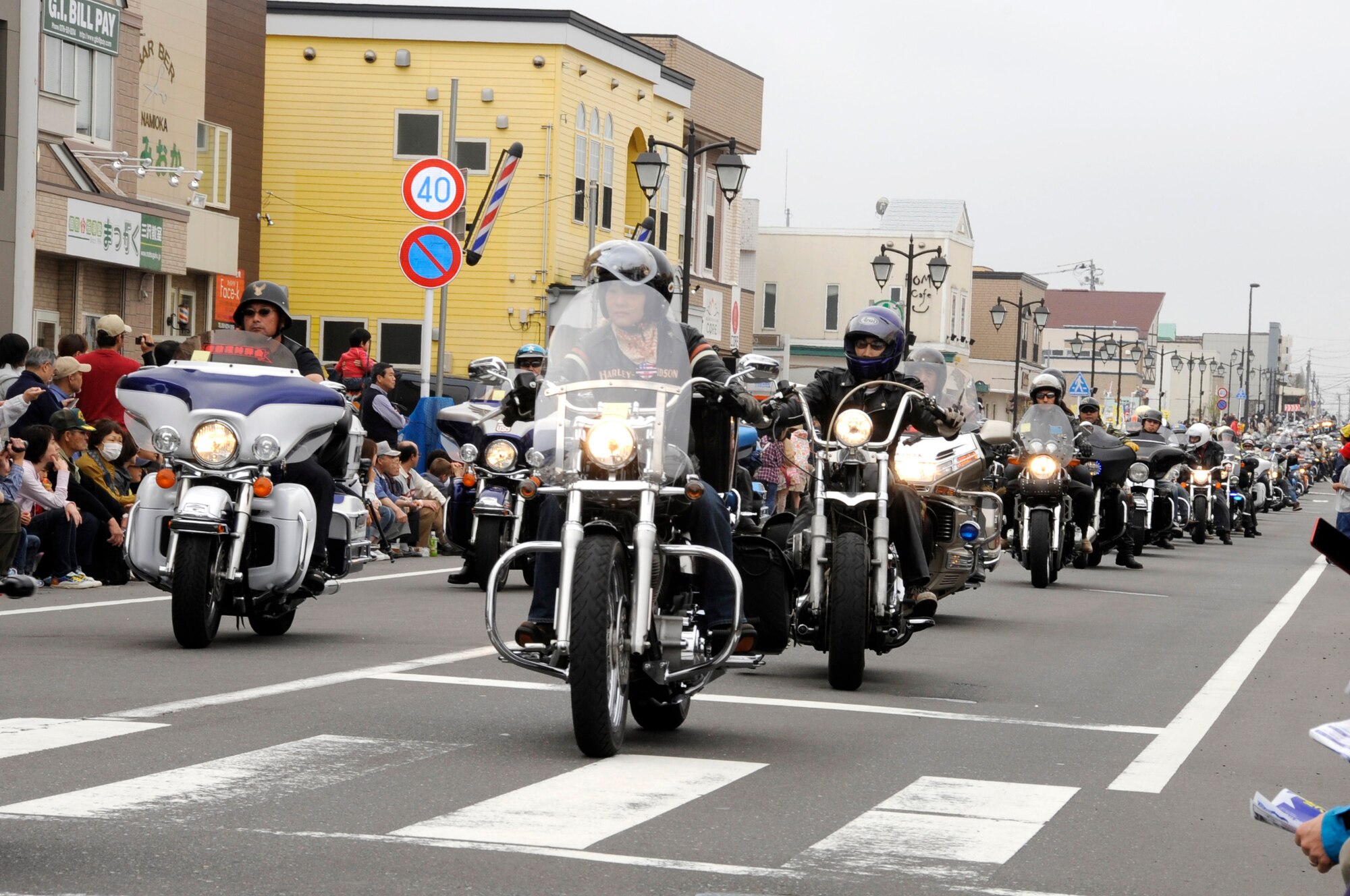 Motorcyclists drive together during the parade at the 24th Annual American Day at Misawa City, Japan, June 3, 2012. More than 100 motorcyclists participated in the parade. (U.S. Air Force photo by Airman 1st Class Kaleb Snay/Released)