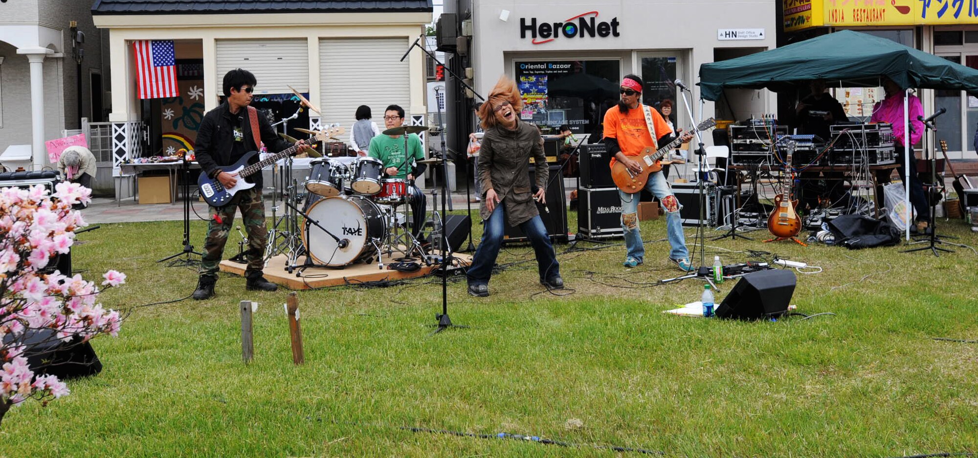 A Japanese band plays in front of the Misawa Air Base main gate at the 24th Annual American Day festival at Misawa City, Japan, June 3, 2012. Attendees were invited to enjoy American and Japanese food, music and culture. (U.S. Air Force photo by Airman Kenna Jackson/Released)