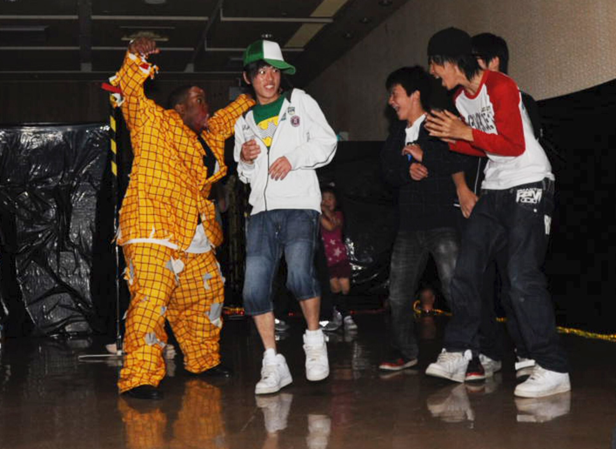 U.S. Airmen, dressed up in frightening costumes, scared kids during the 24th Annual American Day at Misawa City, Japan, June 3, 2012. More than 80,000 people attended the festival to support strengthening bilateral relations. (U.S. Air Force photo by Airman Kenna Jackson/Released)