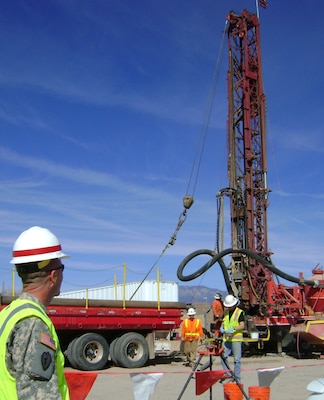 Lt. Col. Williams observed the progress of the well drilling on Kirtland Mar. 1.
