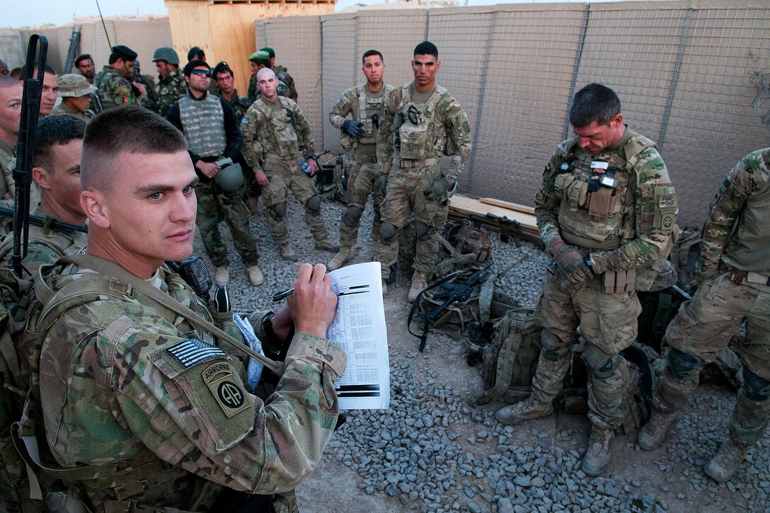 U.S. Army 1st Lt. Kirk Shoemaker calls roll before a patrol on Forward Operating Base Arian in Afghanistan's Ghazni province, May 29, 2012. Shoemaker, a platoon leader, is assigned to the 82nd Airborne Division's 2nd Battalion, 504th Parachute Infantry Regiment, 1st Brigade Combat Team.