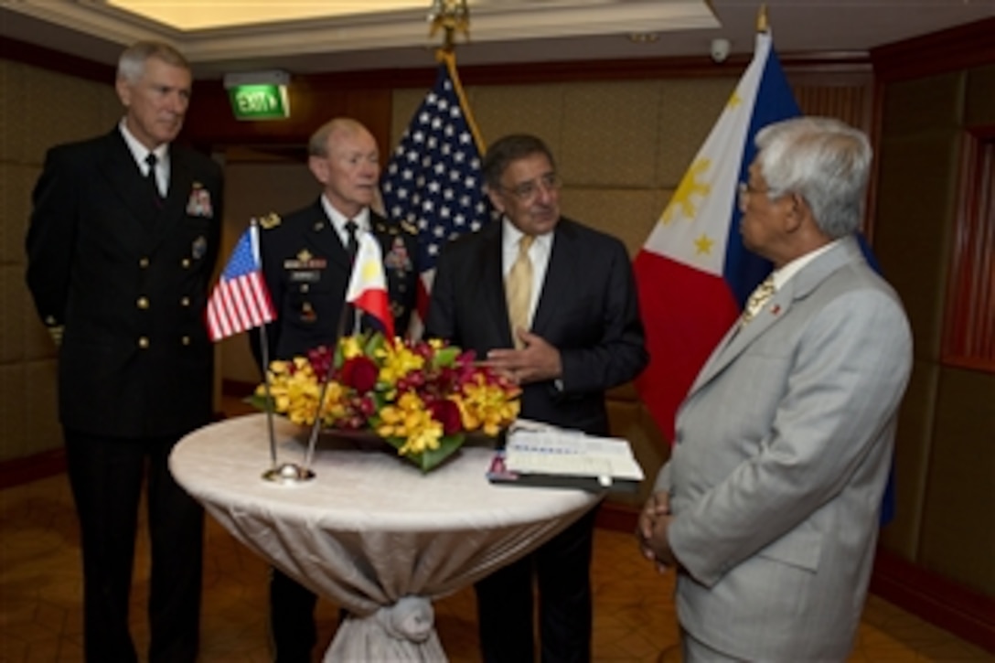 Secretary of Defense Leon E. Panetta (2nd from right) meets informally with the Philippines' Secretary of National Defense Voltaire Gazmin (right) at the Shangri-La Dialogue in Singapore on June 2, 2012.  Commander, U.S. Pacific Command Adm. Samuel J. Locklear (left) and Chairman of the Joint Chiefs of Staff Gen. Martin Dempsey joined Panetta at the conference.  