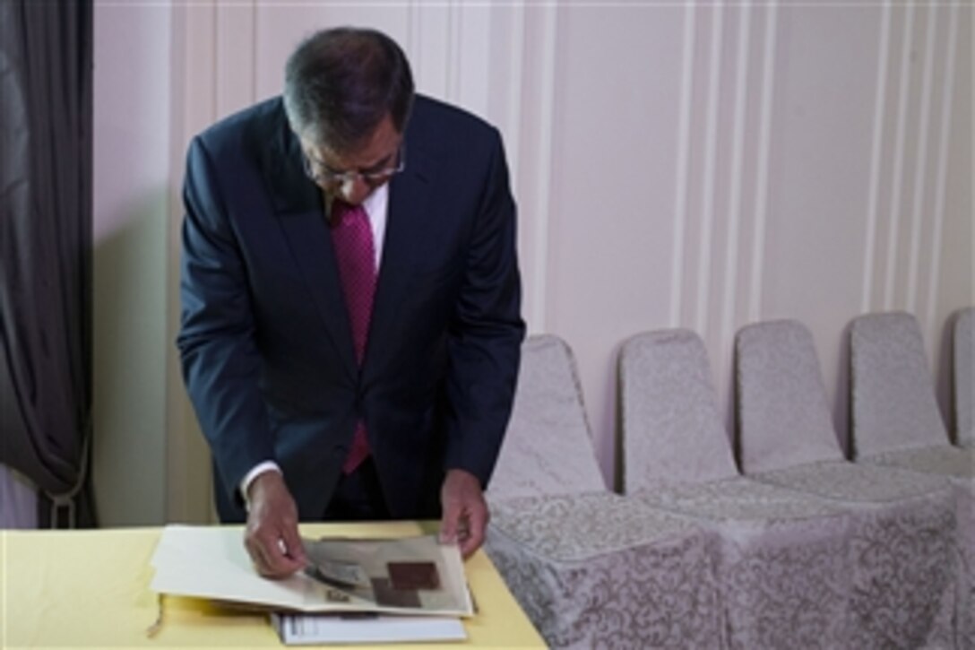 Secretary of Defense Leon E. Panetta looks through a diary that once belonged to Vietnamese soldier Vu Dinh Doan in Hanoi, Vietnam, on June 4, 2012.  The diary will be returned when Panetta meets with Vietnamese Minister of National Defense Senior Lt. Gen. Phuong Quang Thanh to exchange artifacts taken by service members from both nations during the Vietnam War.  The diary has been in the United States since the end of the Vietnam War. 