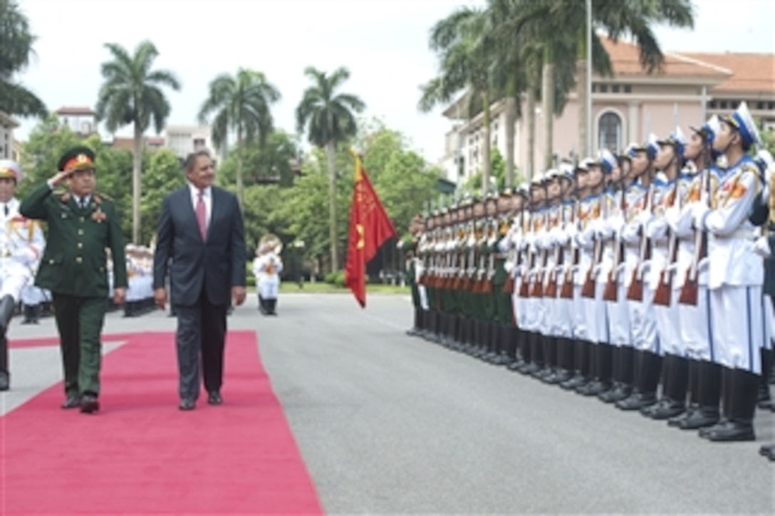 Vietnamese Minister of National Defense Senior Lt. Gen. Phuong Quang Thanh escorts Secretary of Defense Leon E. Panetta as he inspects the troops during welcoming ceremonies for Panetta in Hanoi, Vietnam, on June 4, 2012.  Panetta is on ten-day trip to the Asia-Pacific to meet with defense counterparts.  