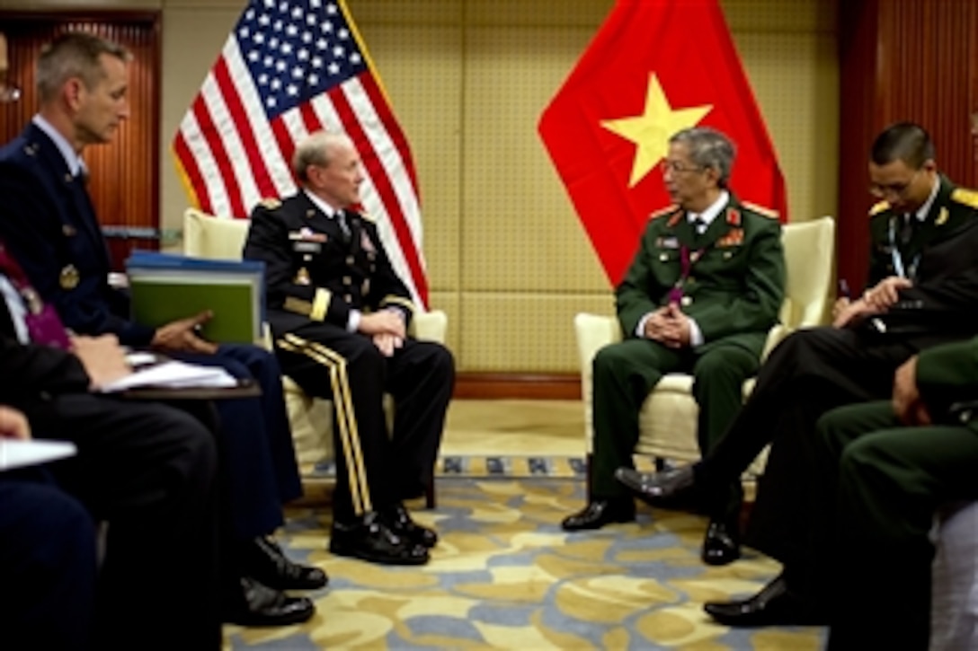 Chairman of the Joint Chiefs of Staff Gen. Martin E. Dempsey meets with Vietnamese Vice Minister of National Defense Lt Gen. Vinh during the Shangri-La Dialogue in Singapore on June 3, 2012.  