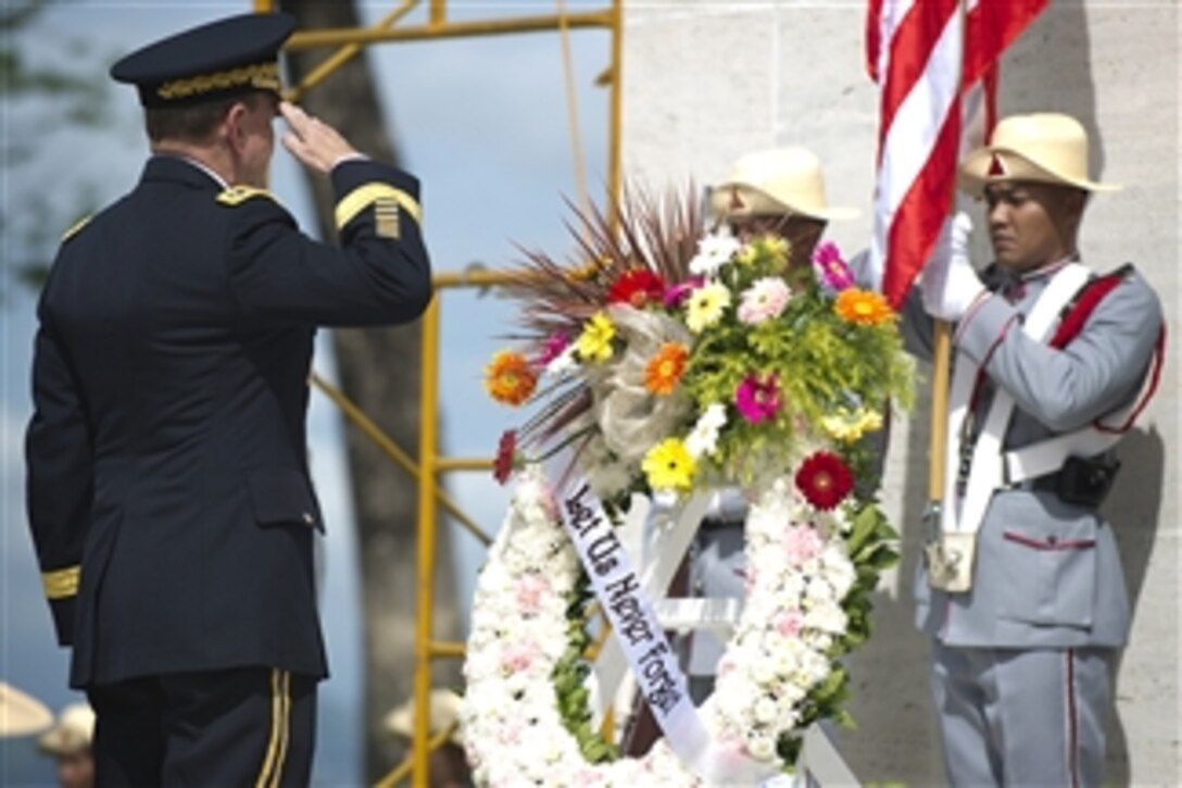 Chairman of the Joint Chiefs of Staff Gen. Martin E. Dempsey salutes after laying a wreath at the Manila American Cemetery and Memorial in Manila, Philippines, on June 4, 2012.  The cemetery contains the largest number of graves of U.S. military dead of World War II, a total of 17,201, most of whom lost their lives in operations in New Guinea and the Philippines.  
