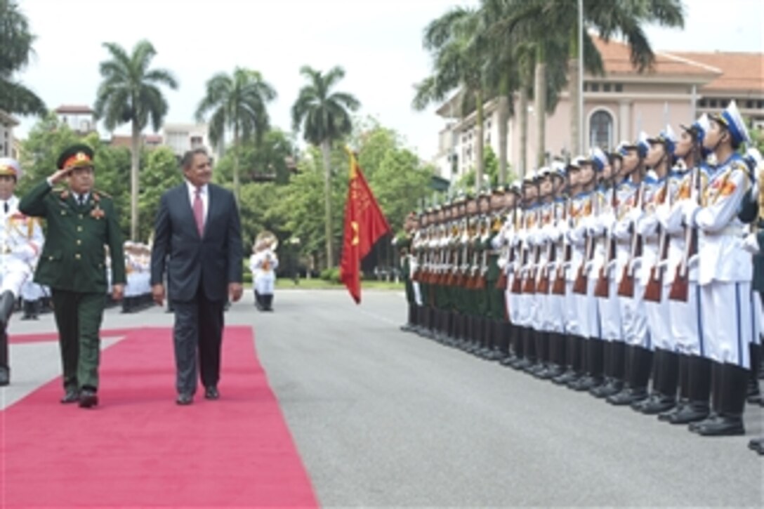 Vietnamese Minister of National Defense Senior Lt. Gen. Phuong Quang Thanh escorts Secretary of Defense Leon E. Panetta as he inspects the troops during welcoming ceremonies for Panetta in Hanoi, Vietnam, on June 4, 2012.  Panetta is on ten-day trip to the Asia-Pacific to meet with defense counterparts.  