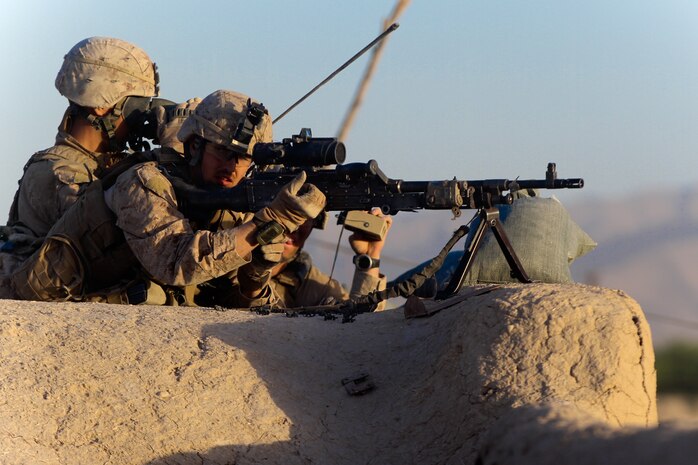 Sergeant Nicholas Crites, a squad leader with 2nd Battalion, 5th Marine Regiments, searches for suspicious activity during a 15-day operation, June 4, 2012. The Marines eliminated more than 50 insurgents, without taking any combat related casualties or civilian casualties.