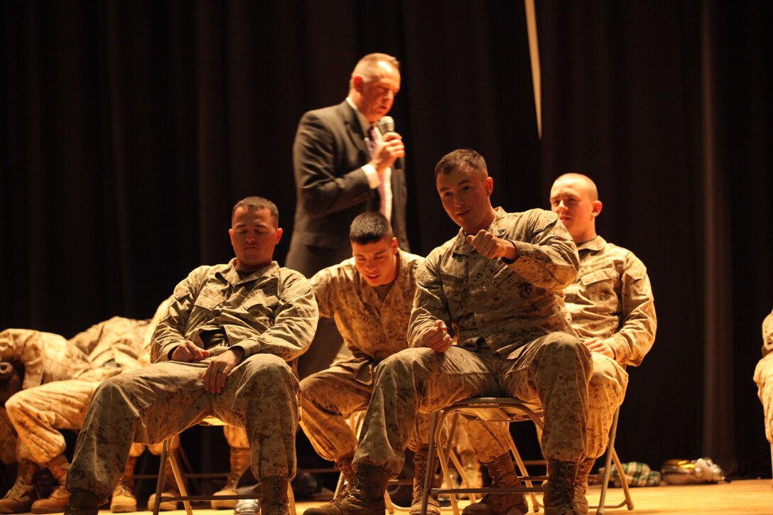 A Marine drives a carful of his fellow Marines after a few imaginary highly intoxicating shots duing a drunk driving stage hypnosis show aboard Marine Corps Base Camp Lejeune, May 22. The Show demonstrated just how drunk driving can change a life. 