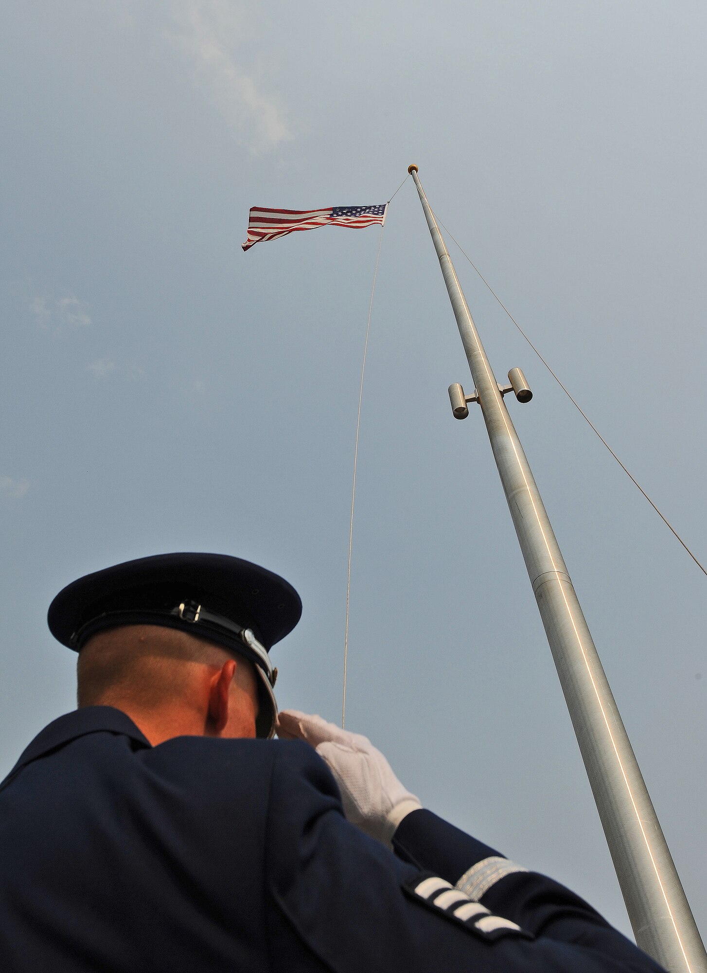WHITEMAN AIR FORCE BASE, Mo. -- A ceremonial guardsman from the 509th Bomb Wing Honor Guard salutes during the playing of the Star Spangled Banner at a Wing Retreat Ceremony in honor of Memorial Day May 24, 2012. Since the end of the Civil War, Memorial Day has been known as a national day of remembrance for those who have fallen while fighting in the United States Armed Forces. (U.S. Air Force photo/Senior Airman Nick Wilson) (Released)