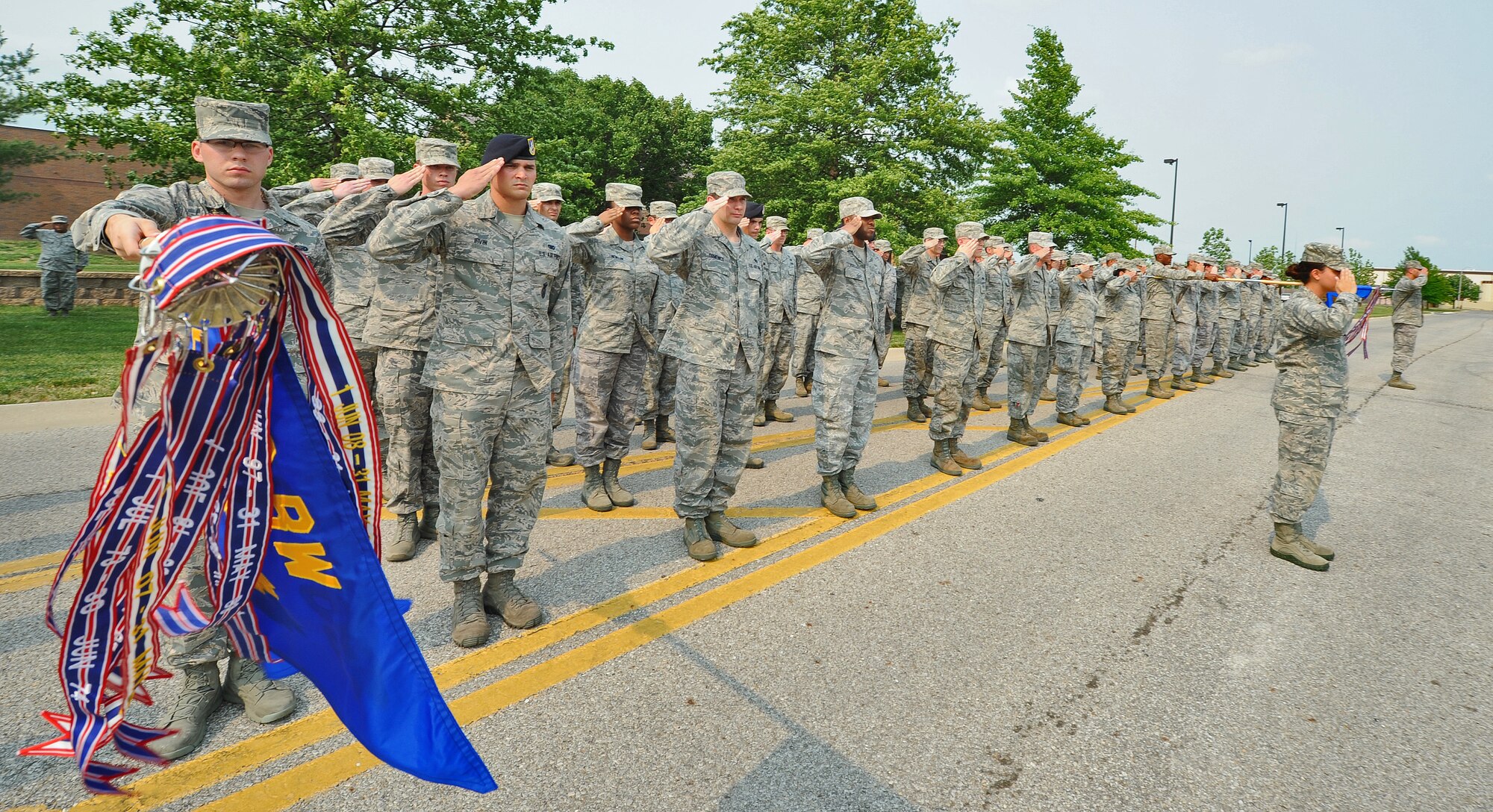 WHITEMAN AIR FORCE BASE, Mo. -- Airmen from the 509th Bomb Wing salute during the playing of the national anthem at a Wing Retreat Ceremony in honor of Memorial Day May 24, 2012. Memorial Day is a day of remembrance for those who died serving in the United States Armed Forces. (U.S. Air Force photo/Senior Airman Nick Wilson) (Released)