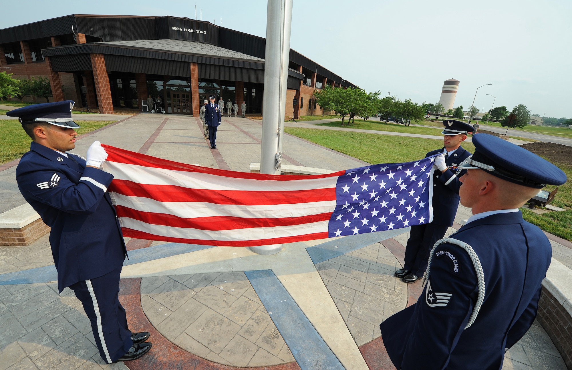 WHITEMAN AIR FORCE BASE, Mo. -- Ceremonial guardsmen from the 509th Bomb Wing Honor Guard perform a flag fold during a Wing Retreat Ceremony May 24, 2012. In honor of Memorial Day, Team Whiteman participated in a Wing Retreat Ceremony following the 2012 spring Wingman Day and Critical Days of Summer campaign. (U.S. Air Force photo/Senior Airman Nick Wilson) (Released)