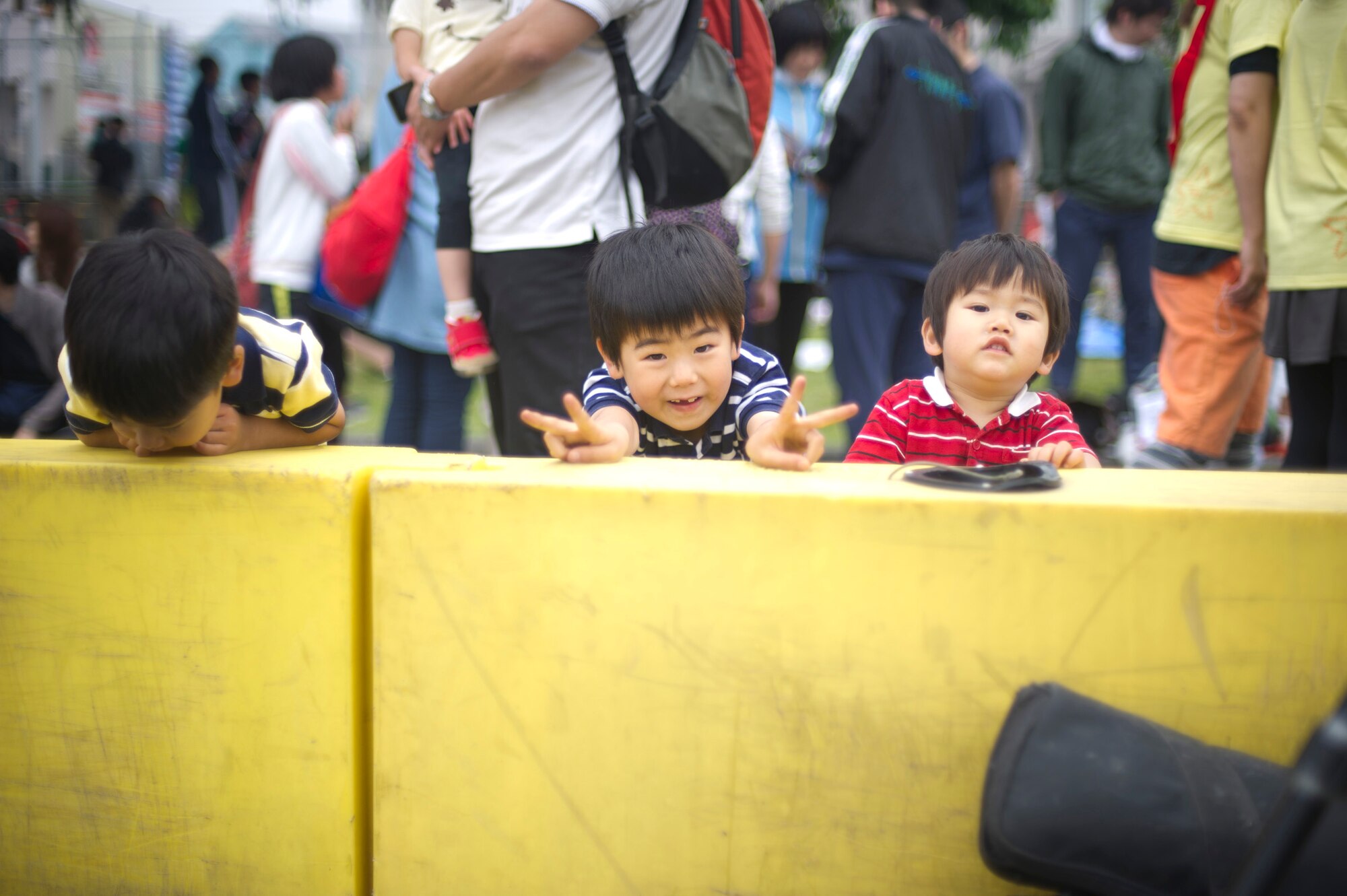 YOKOTA AIR BASE, Japan -- Children pose for a photo during the 28th annual Ekiden Run June 3, 2012, at Yokota, Air Base, Japan. The Striders Running Club centered the Ekiden Run events at the Yokota Middle School. Events were open to the public allowing approximately 6,500 runners and their families from on- and off-base the opportunity to run. (U.S. Air Force photo by Staff Sgt. Stacy Moless)