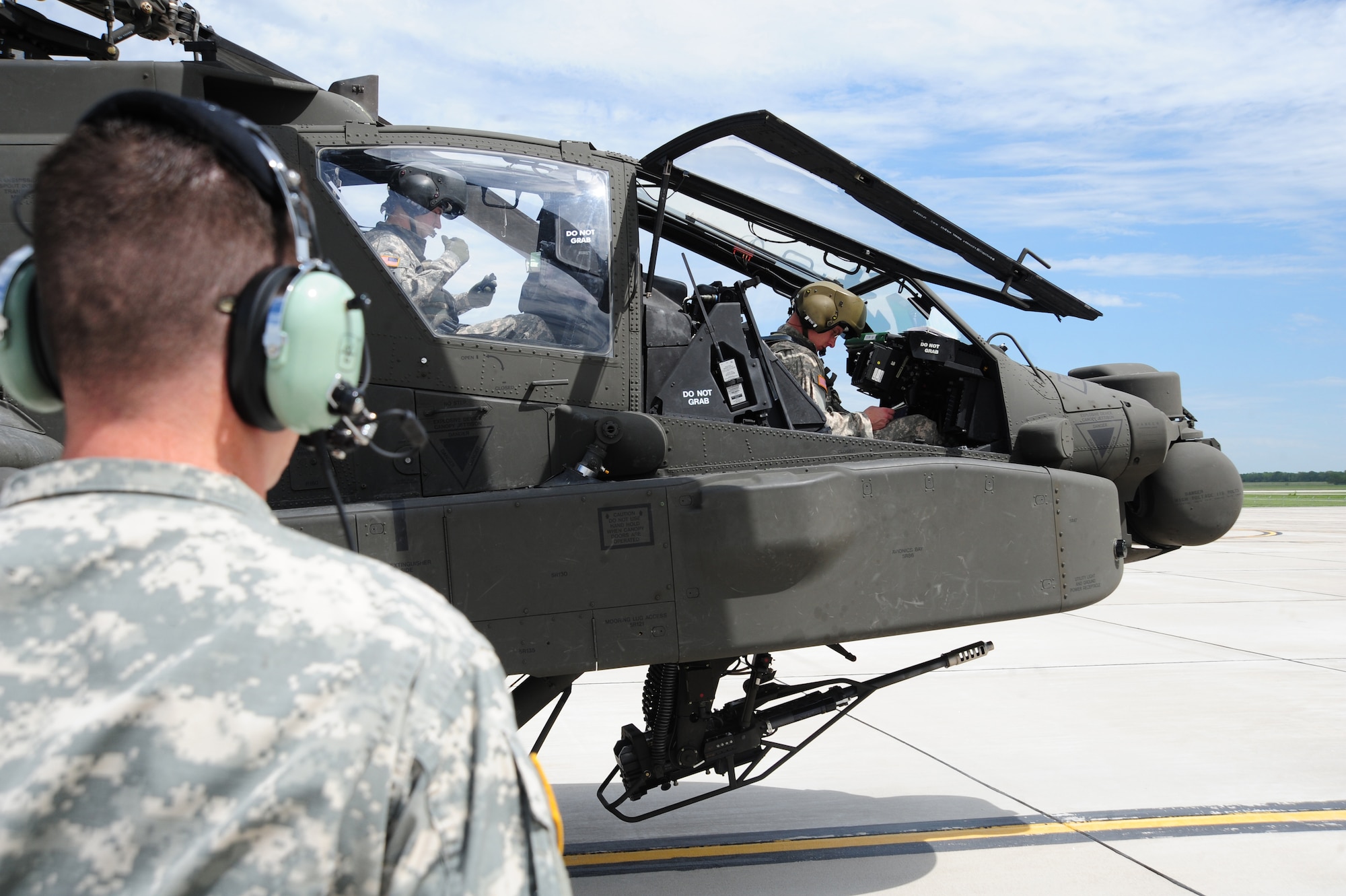 WHITEMAN AIR FORCE BASE, Mo. -- U.S. Army Capt. Joel A. Lewis, 1-135th Attack Reconnaissance Battalion AH-64D Apache Longbow pilot, prepares to fly a training sortie on an AH-64D Apache Longbow April 24, 2012.During the past eight months, the 1-135th ARB has received 20 helicopters to replace an older model. (U.S. Air Force photo/Senior Airman Nick Wilson) (Released)