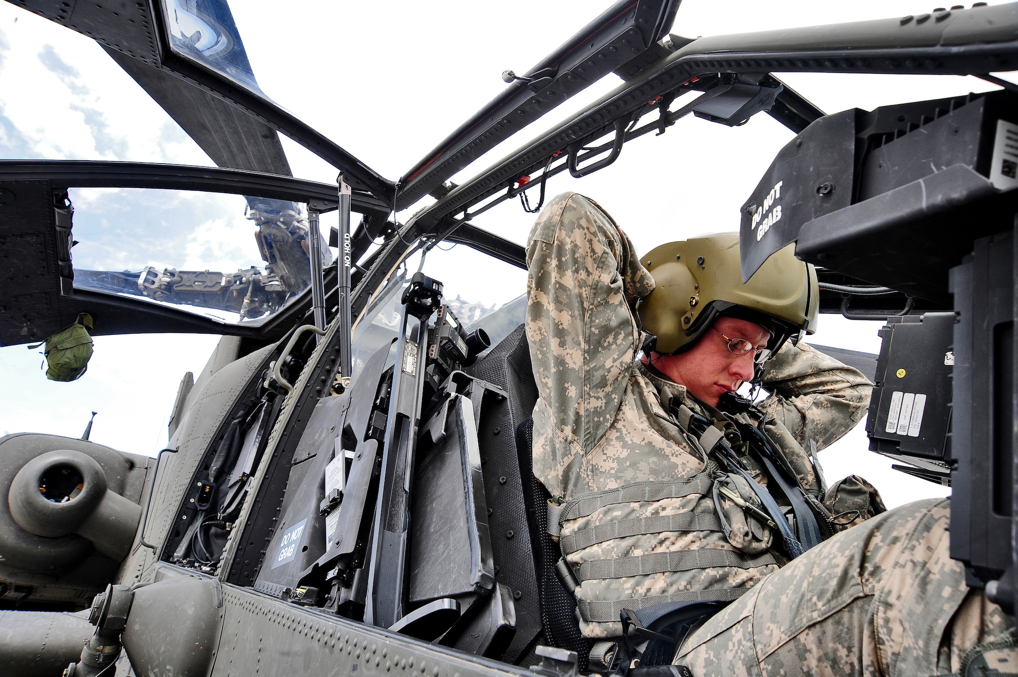 WHITEMAN AIR FORCE BASE, Mo. -- U.S. Army Capt. Joel A. Lewis, 1-135th Attack Reconnaissance Battalion AH-64D Apache Longbow pilot, prepares to fly a training sortie on an AH-64D Apache Longbow April 24, 2012. The Apache's mission is to conduct rear, close and shaping missions to include deep precision strike. (U.S. Air Force photo/Senior Airman Nick Wilson) (Released)