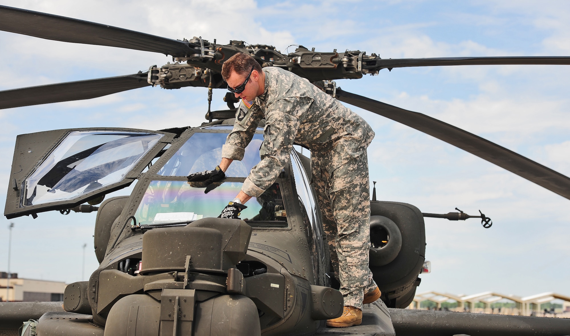 WHITEMAN AIR FORCE BASE, Mo. -- U.S. Army Chief Warrant Officer Allen Crist, 1-135th Attack Reconnaissance Battalion AH-64D Apache Longbow pilot, performs a pre-flight check on an AH-64D Apache Longbow April 24, 2012. During the past decade the AH-64D Apache Longbows have been used to support the mission of the U.S. Armed Forces by providing armed reconnaissance day or night, on the battlefield and in adverse weather conditions.  (U.S. Air Force photo/Senior Airman Nick Wilson) (Released)