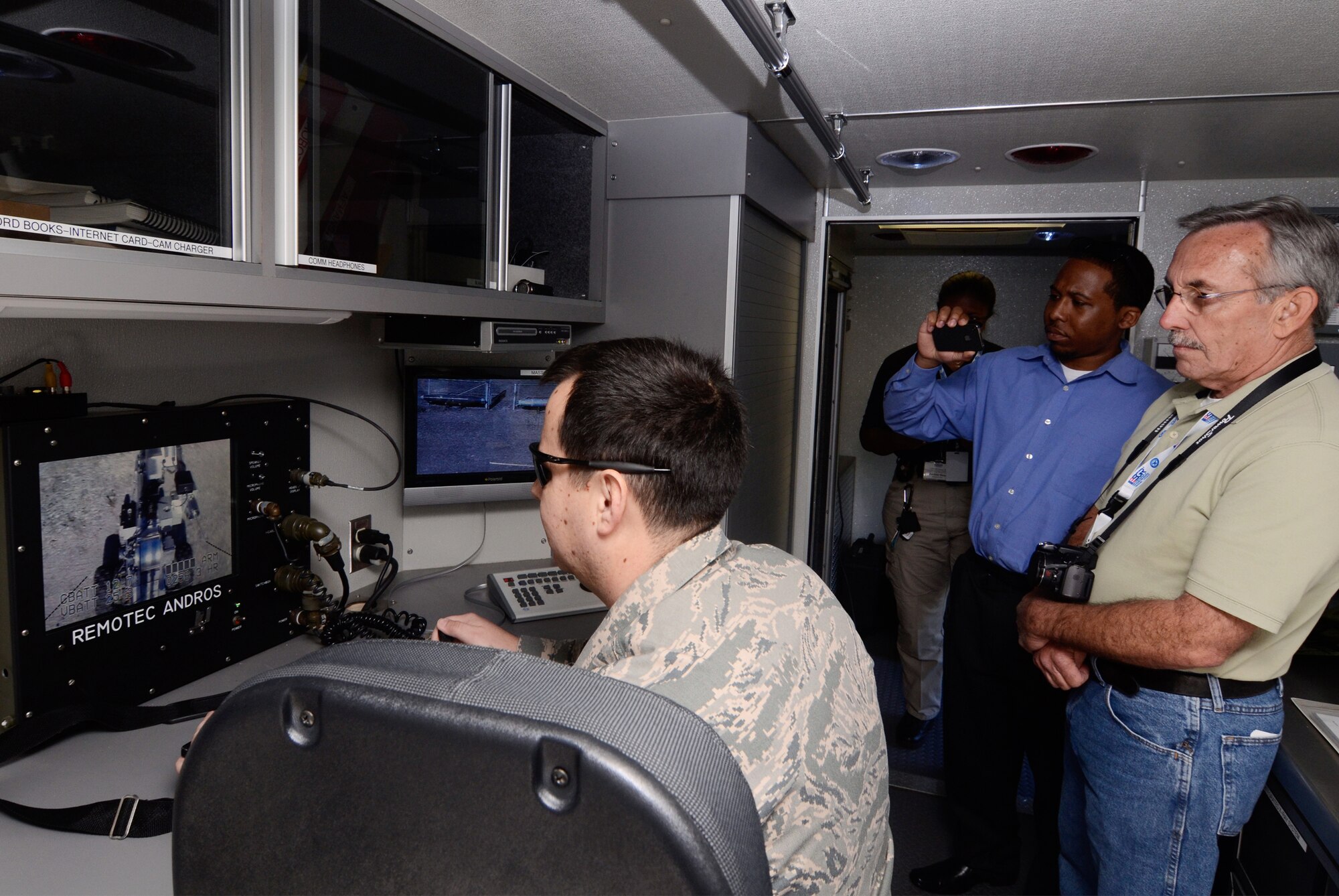 Reservists from the 94th Civil Engineer Squadron, Explosive Ordinance Disposal Flight demonstrate operations of the remote robot during an Employer Appreciation Day base tour May 2. (U.S. Air Force photo/Don Peek)