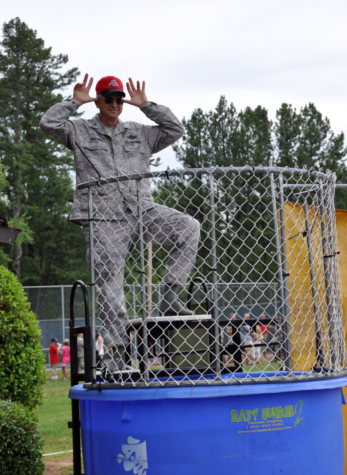 Col. Timothy E. Tarchick, 94th Airlift Wing commander, shows off his best moose antlers in an attempt to distract his would-be dunkers at Family Day on June 3. (U.S. Air Force photo/Senior Airman Elizabeth Gaston)