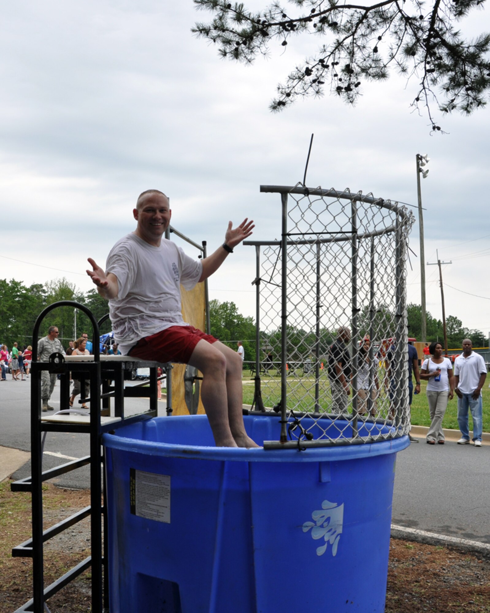 Master Sgt. David F. Strickland, 94th Security Forces Squadron first sergeant, takes a break from taunting his would-be dunkers to pose for the camera at Family Day on June 3. (U.S. Air Force photo/Senior Airman Elizabeth Gaston)