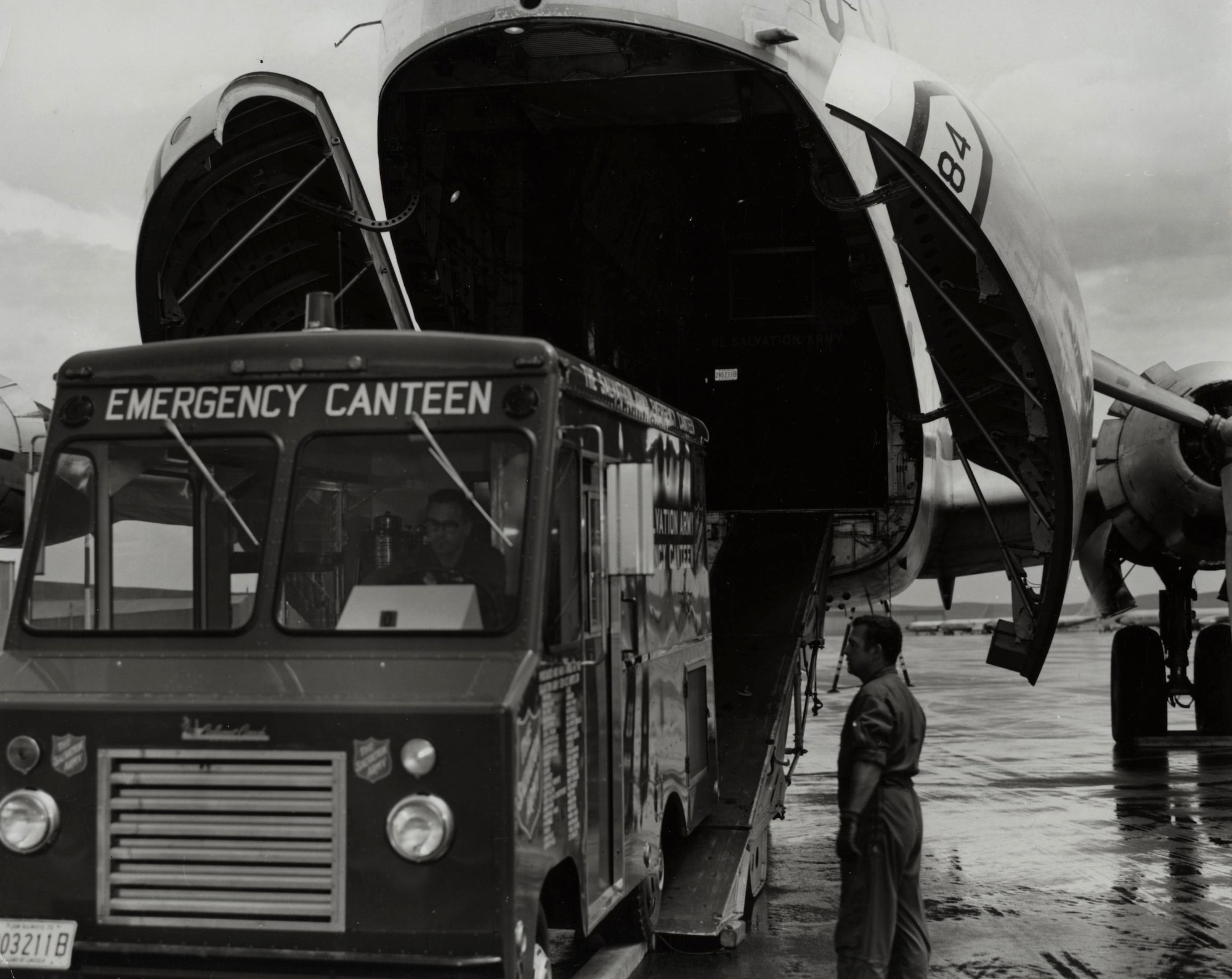 A U.S. Air Force loadmaster oversees the unloading of a Salvation Army canteen response vehicle from a Douglas C-124 Globemaster II at Ellsworth Air Force Base, S.D., following the flood of June 1972. Ellsworth provided equipment, personnel and support nonstop to aid local authorities during rescue and recovery operations.  (U.S. Air Force courtesy photo)