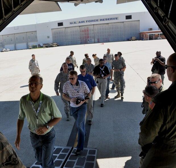 Employers who have reservists assigned to Dobbins Air Reserve Base board a C-130 Hercules during Employer Appreciation Day May 2. (U.S. Air Force photo/Senior Airman Elizabeth Gaston)