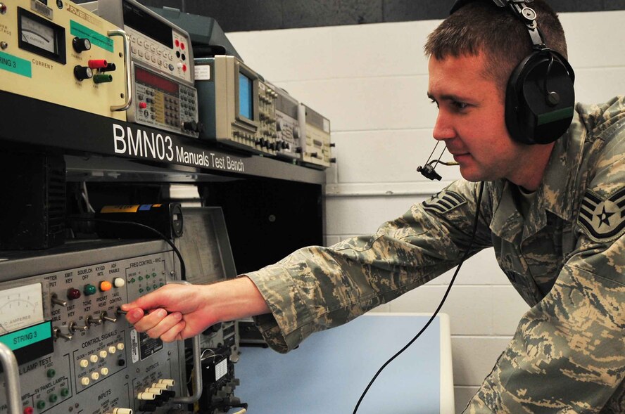 U.S. Air Force Staff Sgt. Michael Kelly, 20th Component Maintenance Squadron avionics intermediate shop production supervisor, runs the ultra high frequency radio to make sure it is functioning properly, Shaw Air Force Base, S.C. June 5, 2012. Kelly is the Shaw Spotlight for the week of June 4 through June 8. (U.S. Air Force photo by Airman 1st Class Ashley L. Gardner/ Released)