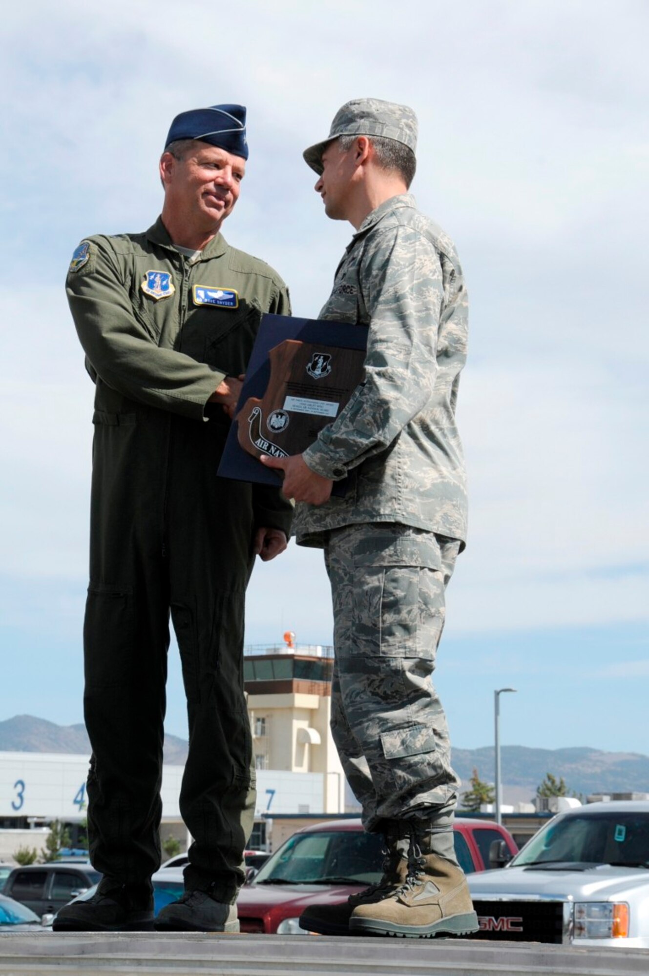 General Snyder presents the Outstanding Unit Award to Col Burkett for the 152nd Airlift Wing's exemplary service from Sept. 15, 2009 through Sept. 14, 2011. (Released)