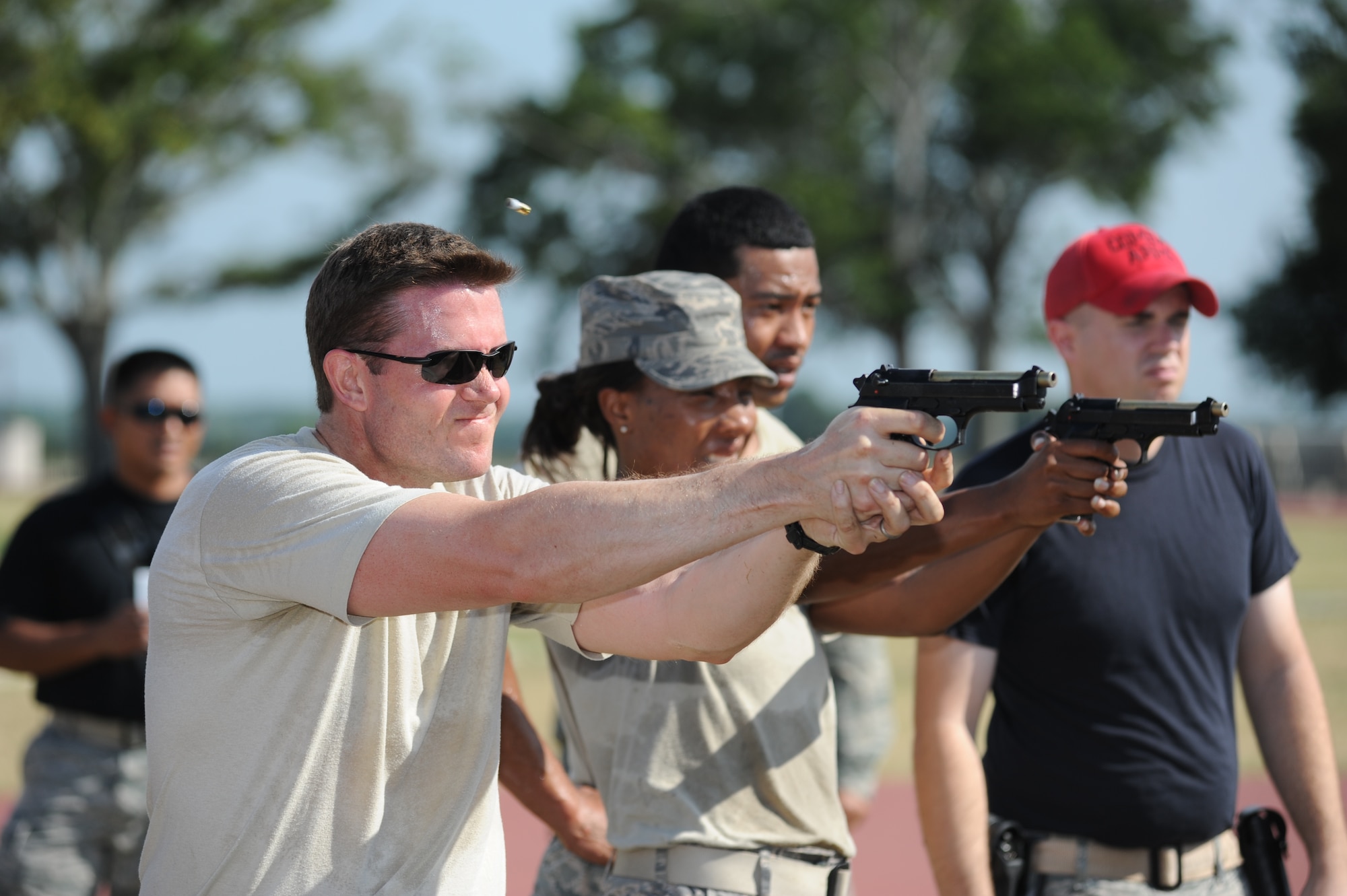 81st Force Support Squadron members, Capt. Rob Bouchillon from team Shock and Awe, and Master Sgt. Tomeika Washington from team Blazers, compete against each other in the “Combat Arms Weapons” challenge during the 81st Mission Support Group Ultimate Warrior Challenge June 1, 2012, at the Triangle Track at Keesler Air Force Base, Miss.  The challenge consisted of team members engaging a target 10 meters away using an M9 weapon with 10 rounds.  The challenge was held in honor of fellow service members who lost their lives in the fight for our nation’s freedom. It consisted of nine four-member teams racing in a competition designed to take them through various aspects of a deployment. (U.S. Air Force photo by Kemberly Groue)