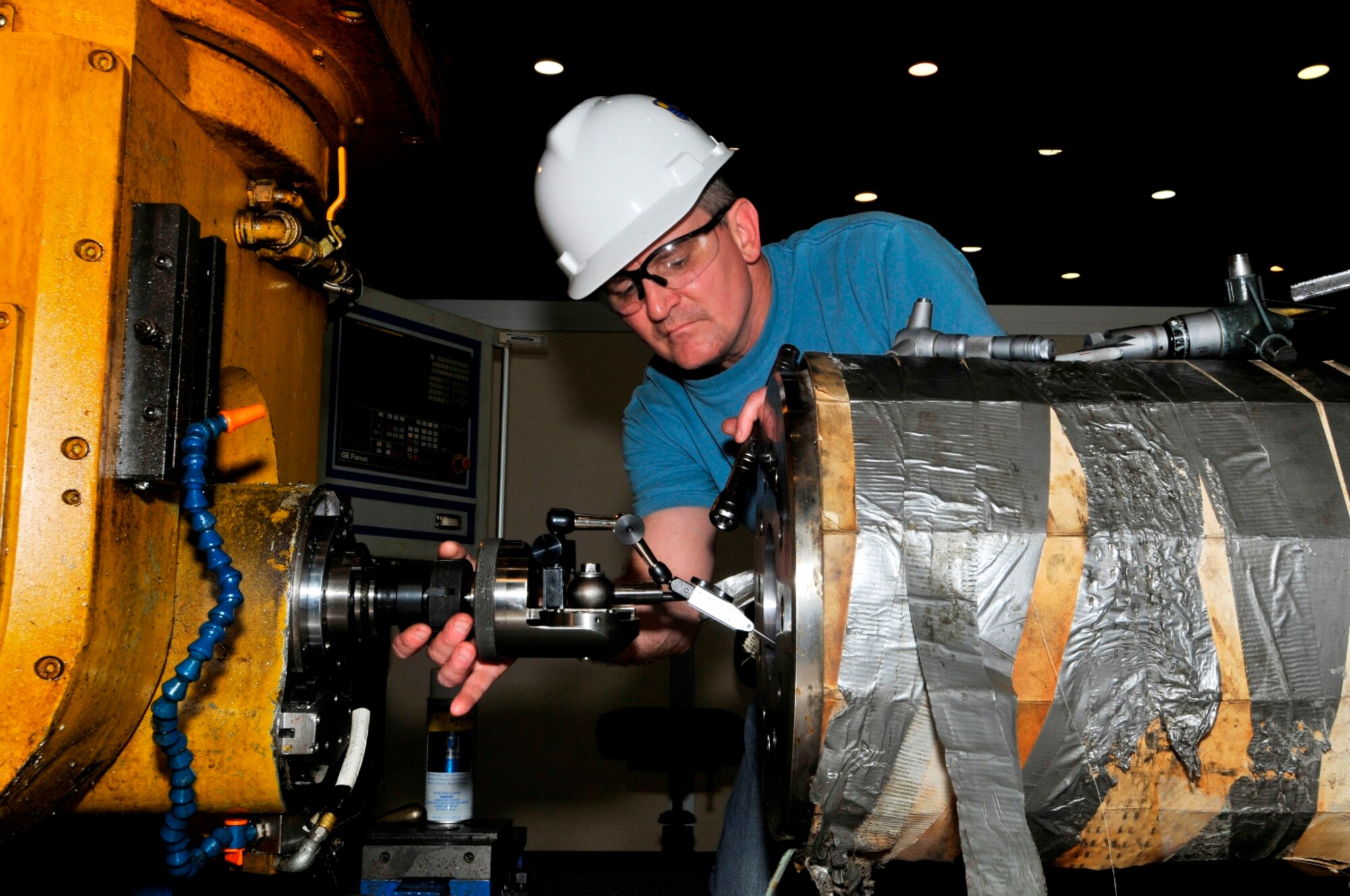 Russell Arbuckle, an ATA inside machinist, operates the computer numerical control (CNC) gantry mill on one of AEDC’s Hypervelocity Ballistic Range G’s gun barrels.