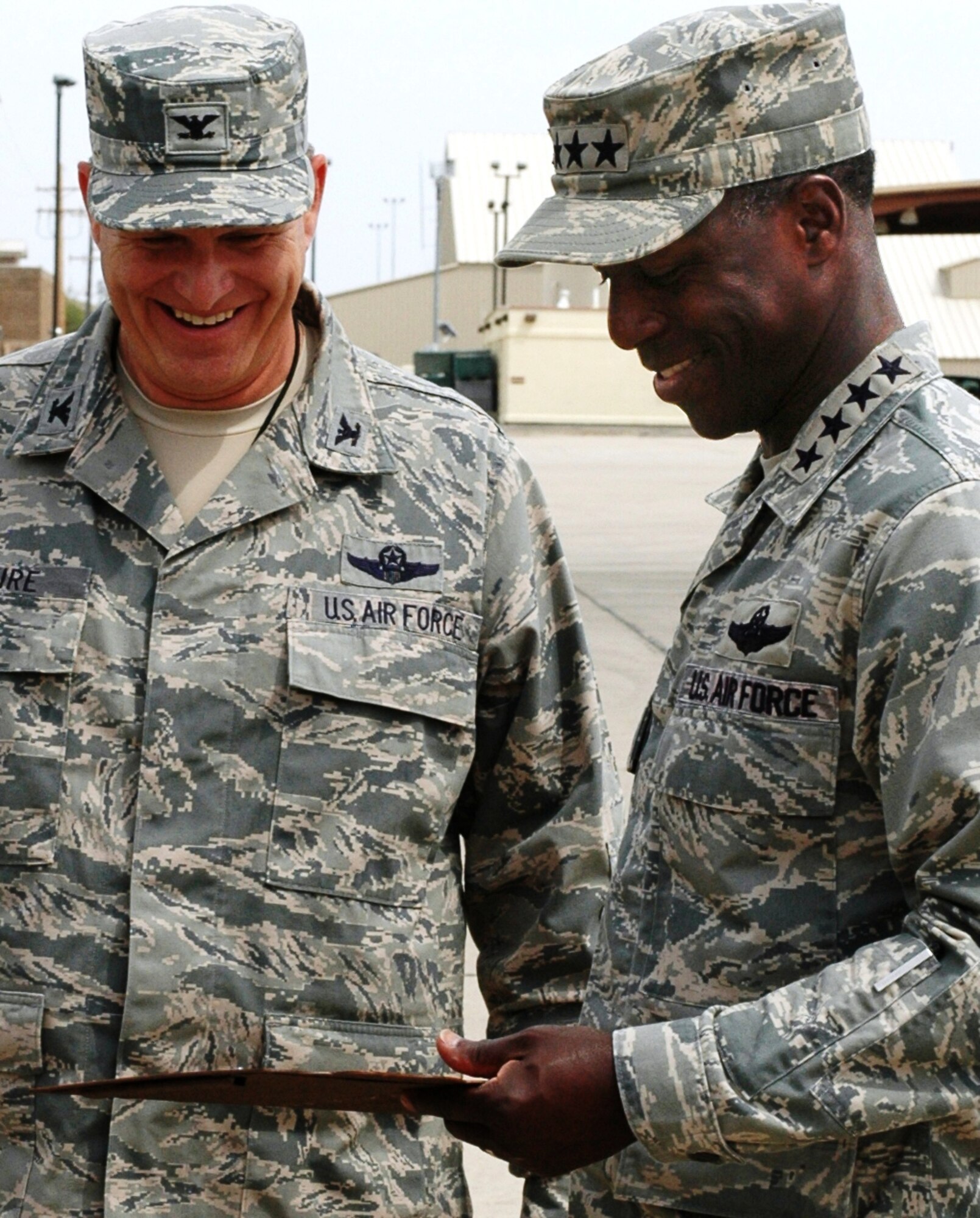 U.S. Air Force Gen. Edward A. Rice Jr., commander of Air Education and Training Command, accepts a memento from 162nd Fighter Wing Commander Col. Mick McGuire after his visit to the Arizona Air National Guard’s F-16 Fighting Falcon training unit at Tucson International Airport. Rice visited the unit to observe activities during the June Unit Training Assembly.  (U.S. Air Force photo by 1st Lt. Angela Walz)