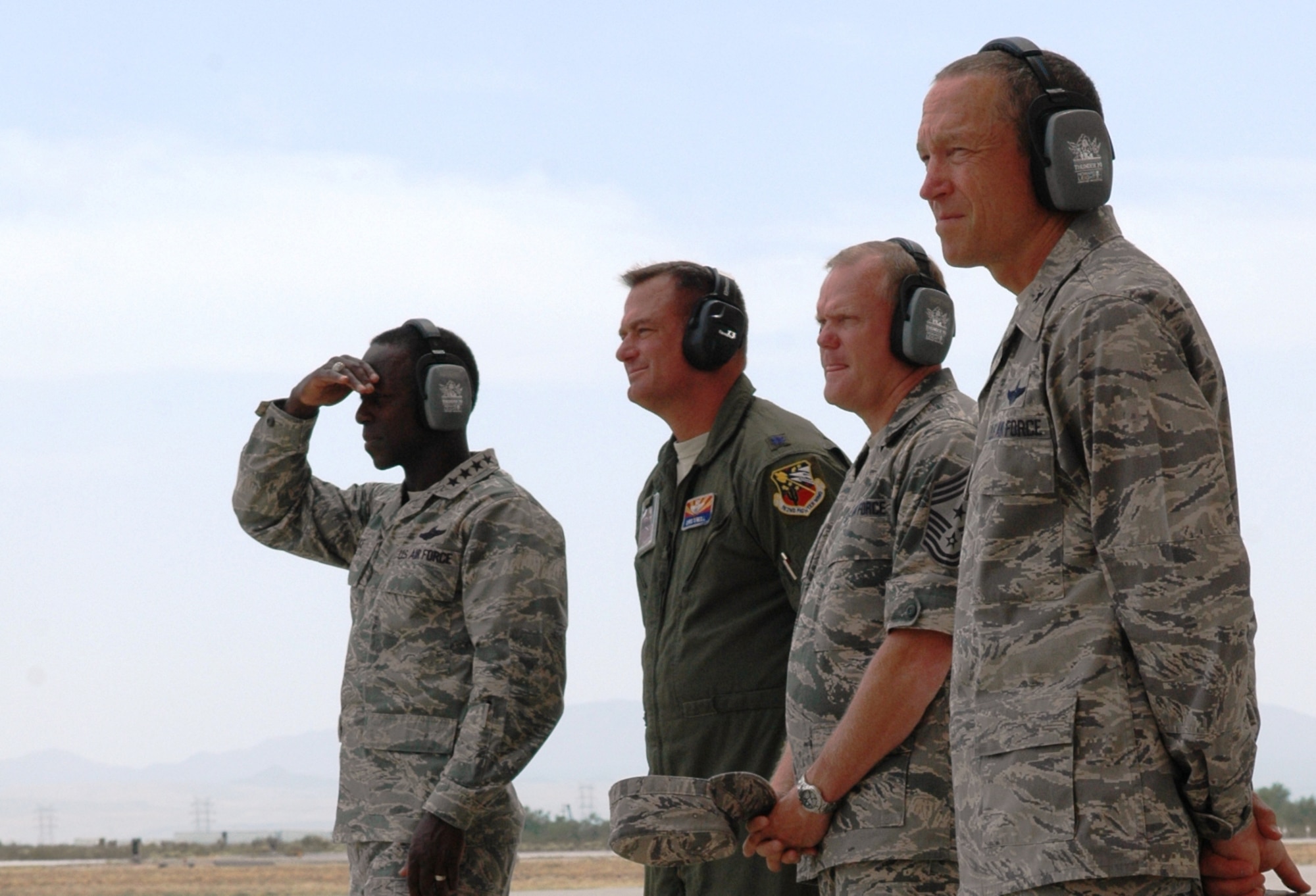 (From the left) U.S. Air Force Gen. Edward A. Rice Jr., Air Education and Training Command commander; Lt. Col. Chris O’Neill, 162nd Fighter Wing Aerospace Control Alert Detachment commander; Chief Master Sgt. James A. Cody, AETC command chief master sergeant; and Brig. Gen. Paul L. Ayers, Air National Guard assistant to the AETC commander, watch Arizona Air National Guard F-16 Fighting Falcons scramble from the 162nd's Alert Detachment at Davis-Monthan Air Force Base, Ariz. The wing’s role in homeland defense is unique for a fighter training unit. (U.S. Air Force photo by 1st Lt. Angela Walz)