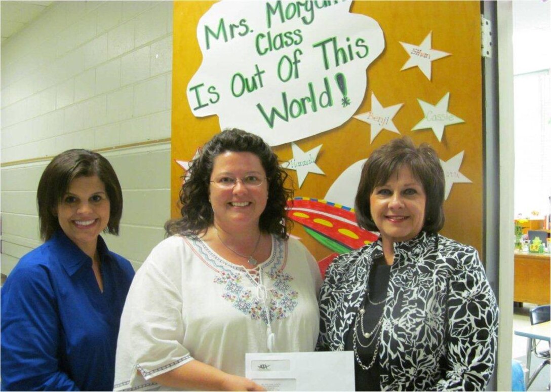 Aerospace Testing Alliance Employee & Community Activities Council Treasurer Stacey Lowe-Allen presents a check to Tullahoma Bel-Aire Elementary teacher Wendy Howell and Principal Donna Rhoton. The donation will be used to purchase math and science educational kits. (Photo provided)