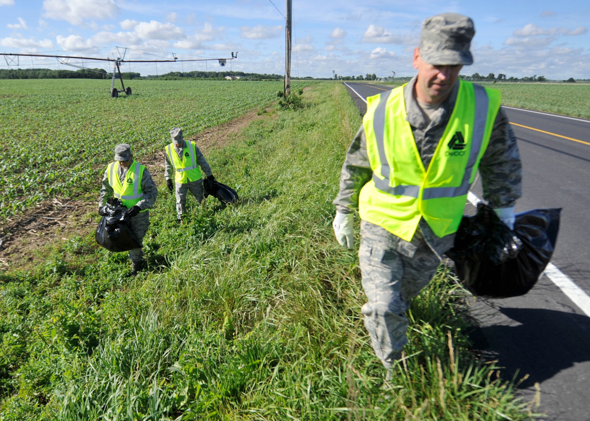 Members of the Dover Air Force Base, Del., Chiefs' Group clean a section of Route 9 June 5, 2012, in Dover, Del. The Chiefs' Group was cleaning Route 9 as part of its support of the Adopt-A-Highway campaign. (U.S. Air Force photo by Tech. Sgt. Chuck Walker)