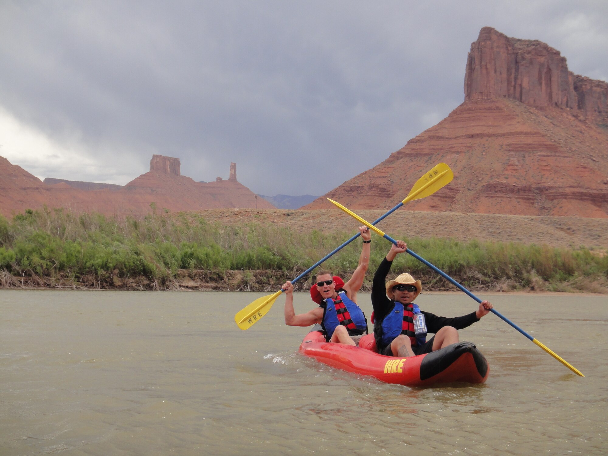 MOAB, Utah - Maj. Adrian Cercenia, 21st Communications Squadron, and U.S. Marine Corps Capt. Steve Murello, National Security Space Institute, kayak down the Colorado River on a three-day trip to Moab, Utah, planned by Outdoor Recreation. The trip consisted of a slick rock off-road vehicle tour, rafting and kayaking, and hiking in Arches National Park. For more information on future trips, contact Outdoor Recreation at 556-4867. (U.S. Air Force photo/Capt. Holly Hess)