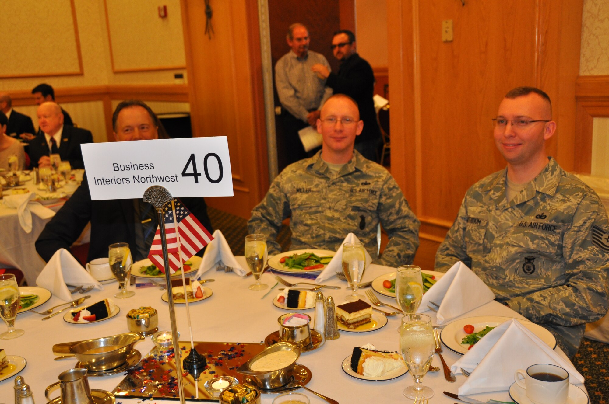 Members of the 477th Fighter Group enjoy the Anchorage Chamber of Commerce Military Appreciation lunch June 4. Anchorage businesses purchased tables and invited military members to attend the lunch which kicked-off the Chamber of Commerce’s19th Annual Military Appreciation week that will conclude with a Military Appreciation Picnic June 8.  (U.S. Air Force Photo/Capt. Ashley Conner) 