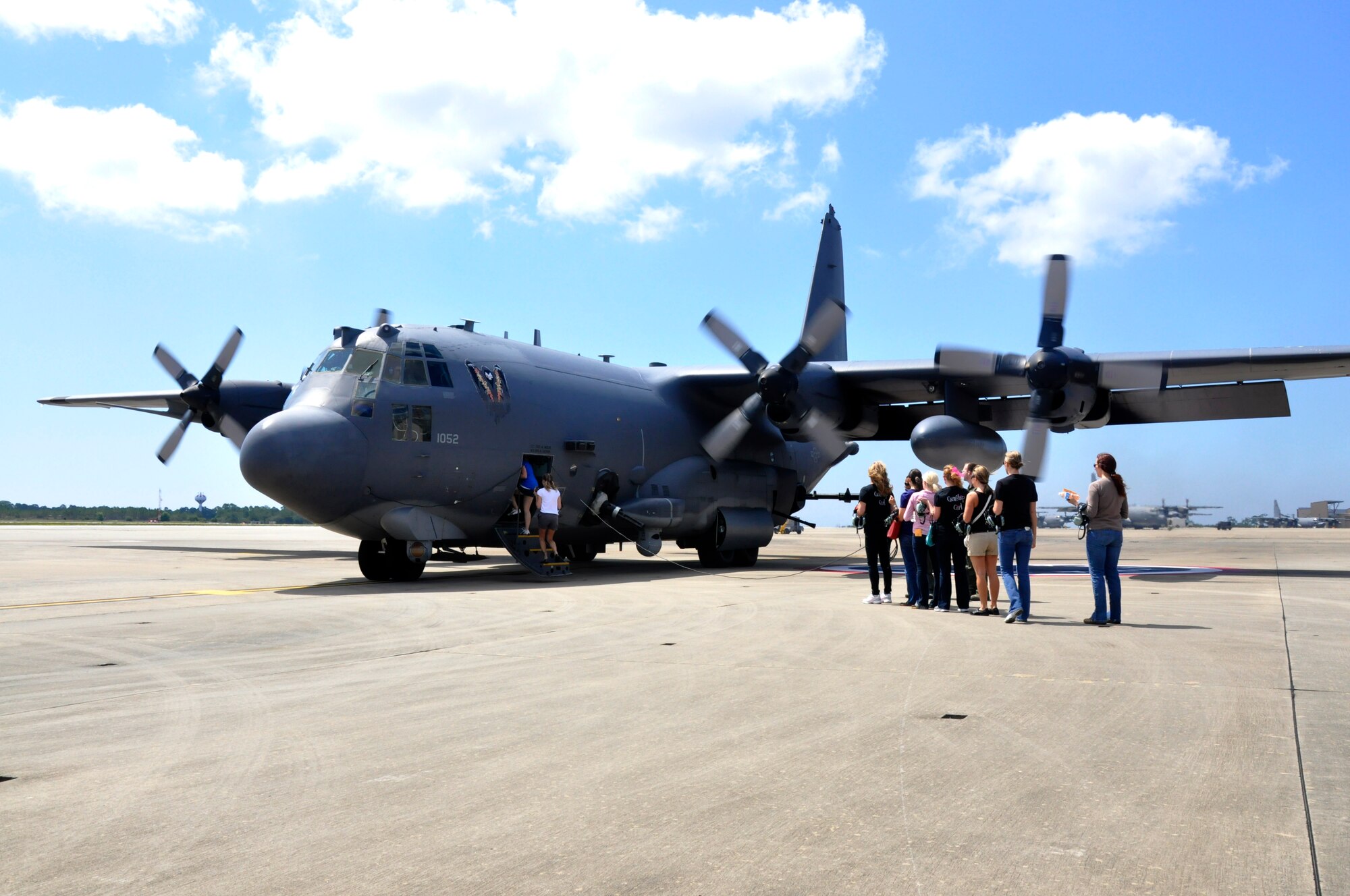 A group of 4th Special Operations Squadron spouses prepare to board an AC-130U Gunship during Commando Spouse Day at the flightline at Hurlburt Field, Fla., May 19, 2012. The spouses participated in the event to gain more insight into their spouse's duties with the squadron. (U.S. Air Force photo / Senior Airman Joe McFadden) (Released)