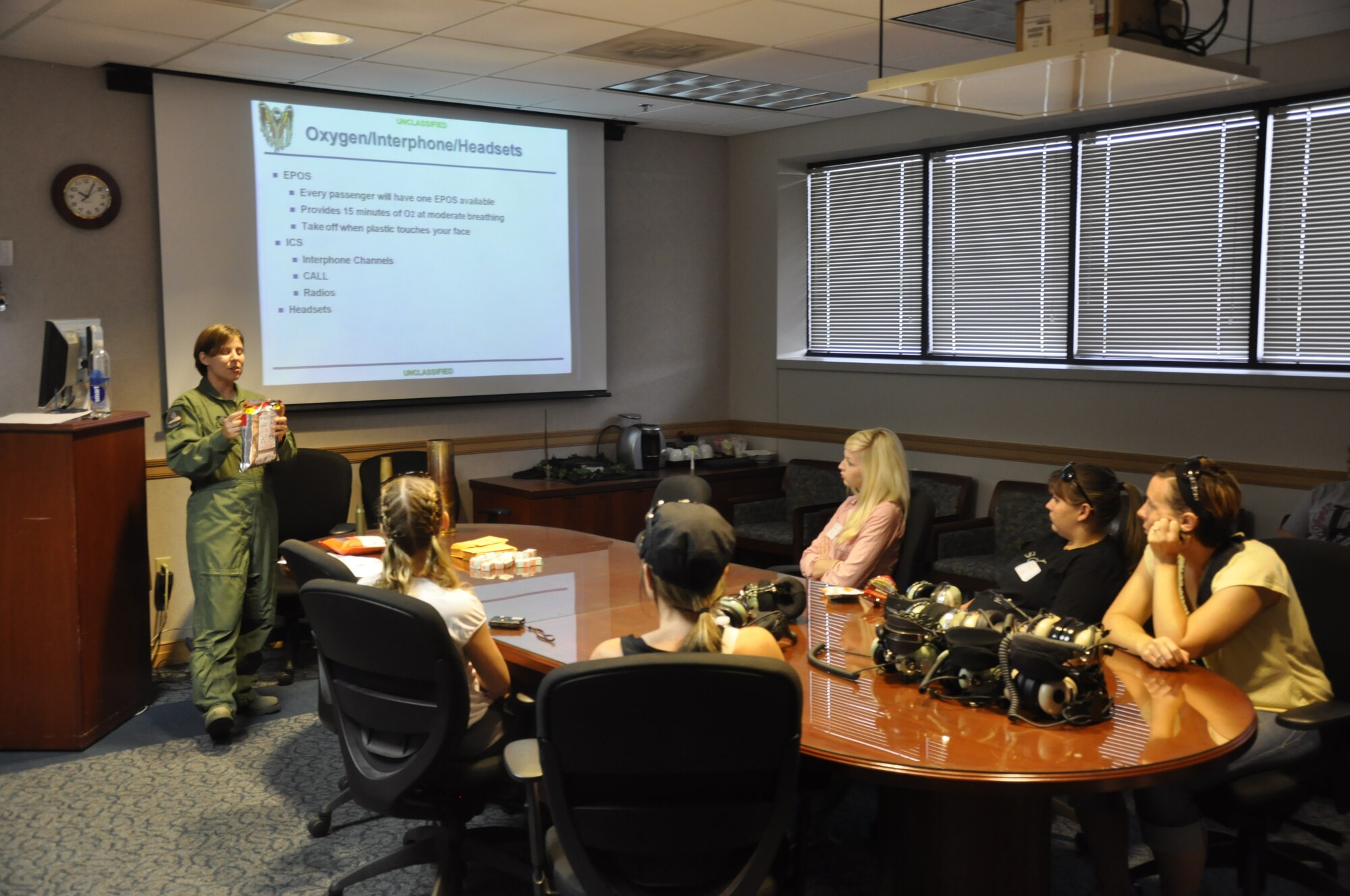 Tech. Sgt. Christy Calvert, a flight engineer of 4th Special Operations Squadron, briefs a group of 4th SOS spouses about pre-flight safety before flying on an AC-130U gunship during Commando Spouse Day at the 4th Special Operations Squadron at Hurlburt Field, Fla., May 19, 2012. Spouses from various 1st Special Operations Wing squadrons had an opportunity to fly on wing aircraft during the event. (U.S. Air Force photo / Senior Airman Joe McFadden) (Released)