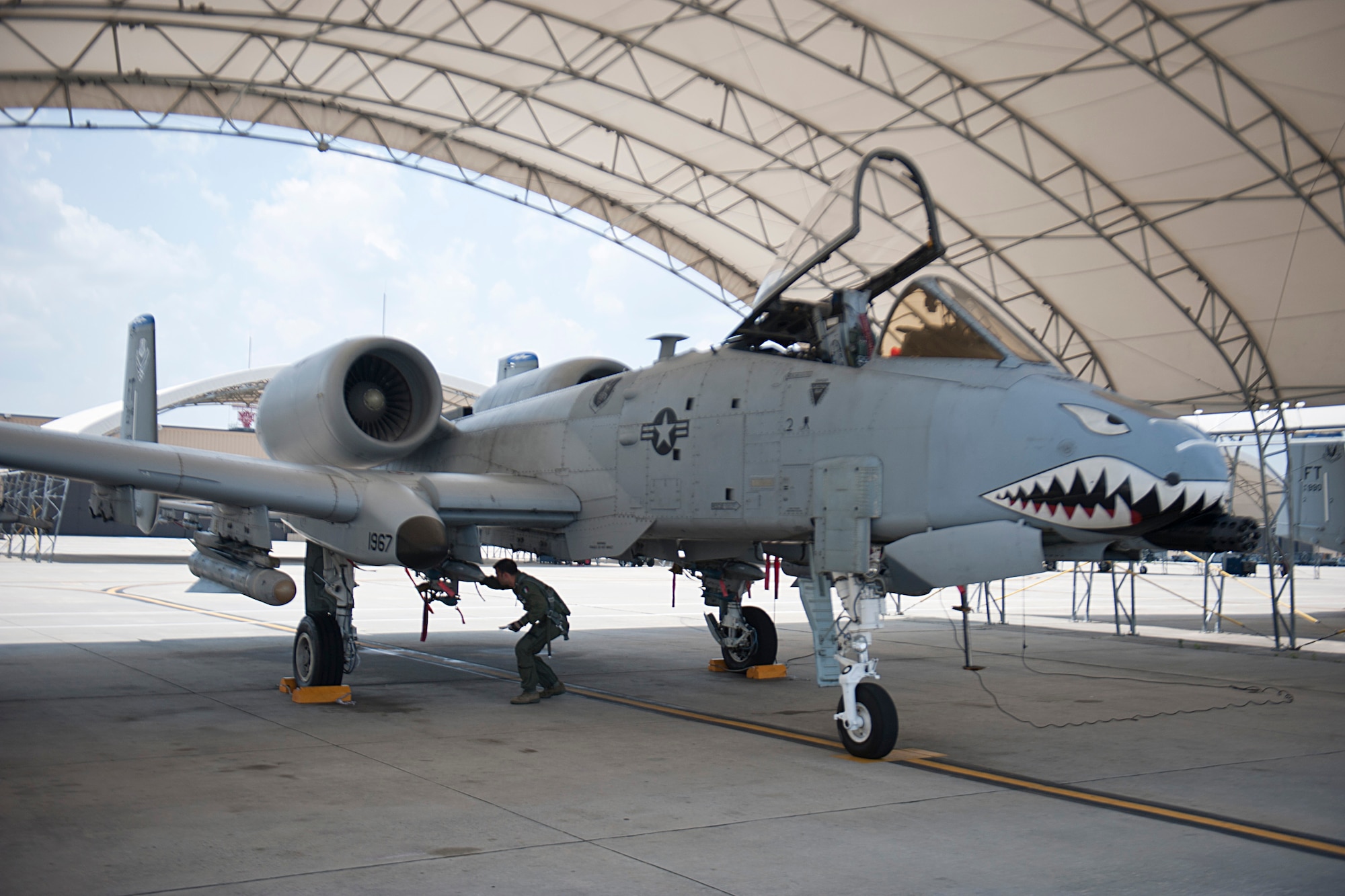 Italian air force Capitano (Capt.) Maurizio De Guida, 74th Fighter Squadron exchange pilot, conducts a pre-flight check on an A-10C Thunderbolt II May 31, 2012, at Moody Air Force Base, Ga. De Guida has been at Moody since 2009 and is the first Italian to fly the A-10. In Italy, he flies the AMX, a ground attack aircraft with similar functions to the A-10. (U.S. Air Force photo by Staff Sgt. Jamal D. Sutter/Released) 