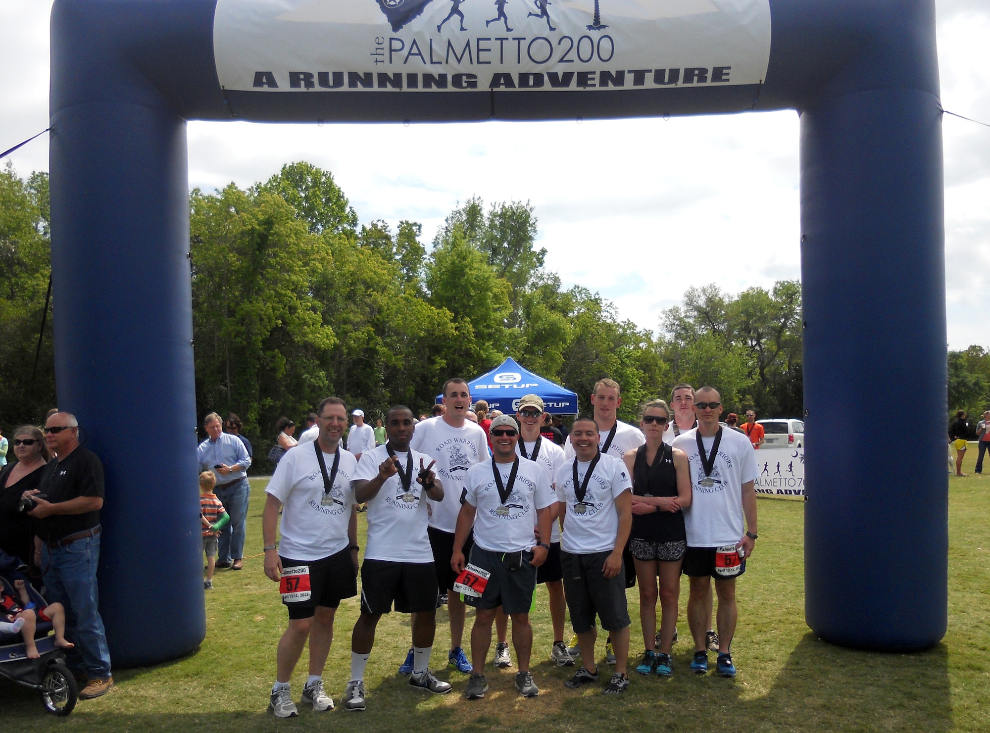 The Road Warriors Running Club of South Carolina stands at the finish line after running the Palmetto200 relay race from Cayce, S.C. to Folly Beach, S.C., April 13, 2012. The Palmetto200 relay race was held to raise money for the Juvenile Diabetes Foundation. The Road Warriors Running Club raised roughly $800 for the Juvenile Diabetes Foundation and about $700 for the Wounded Warrior Project. (U.S. Air Force photo by Tech Sgt. Jason Formanack/released)