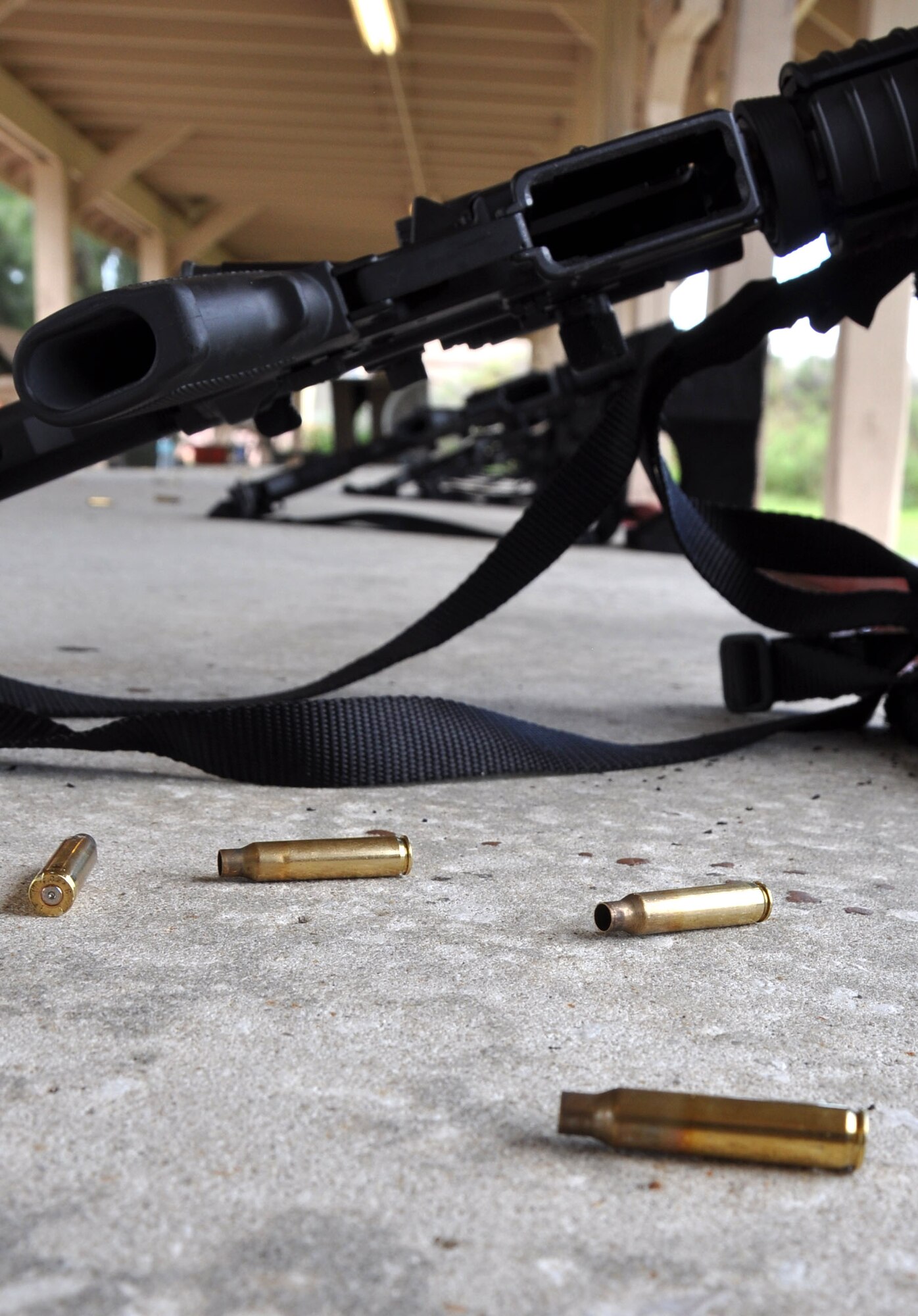 MACDILL AIR FORCE BASE, Fla. – The new Air Force Rifle/Carbine Qualification Course better prepares Airmen for urban combat by teaching them how to effectively discern targets in a crowded setting, move while firing, communicate to their comrades and has doubled the amount of rounds used.  Empty shell casings testify to the practice at home that will save lives overseas. (Official U.S. Air Force photo/Staff Sgt. Shawn Rhodes)