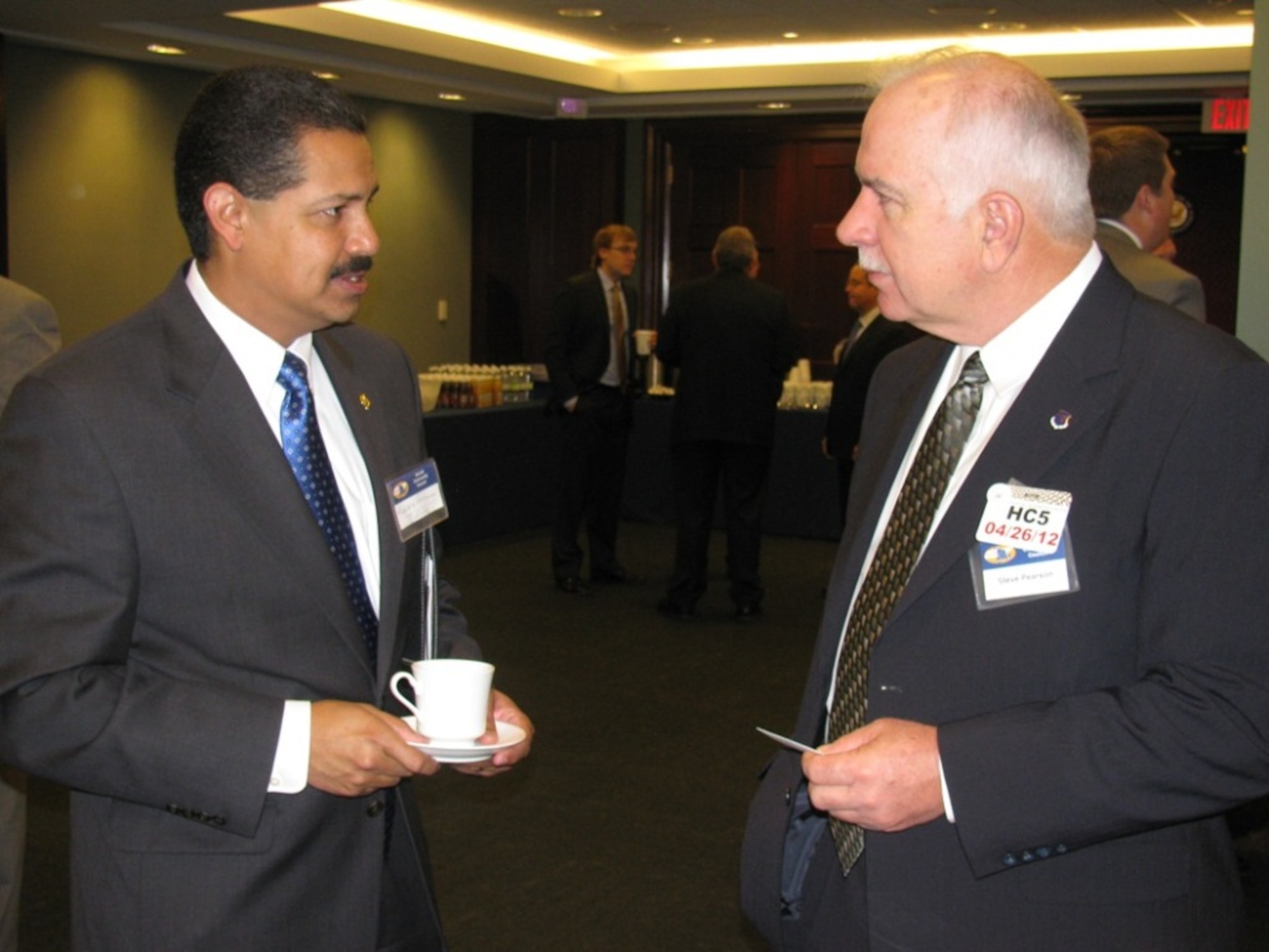 The executive director of the Antelope Valley Board of Trade, Vickie Medina, visits with some of the attendees at a breakfast on Capitol Hill.