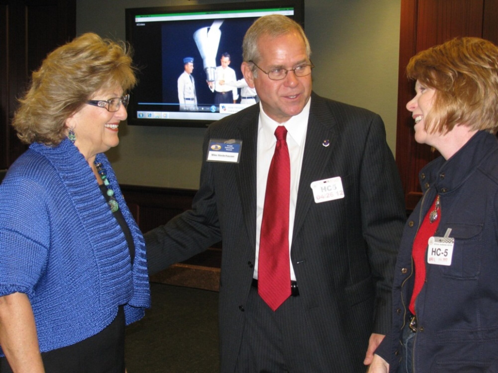 ATA General Manager, Steve Pearson, (right) and Boeing Site Manager for Edwards AFB/NASA Dryden, Al Hoffman, discuss aerospace and exchange business cards.