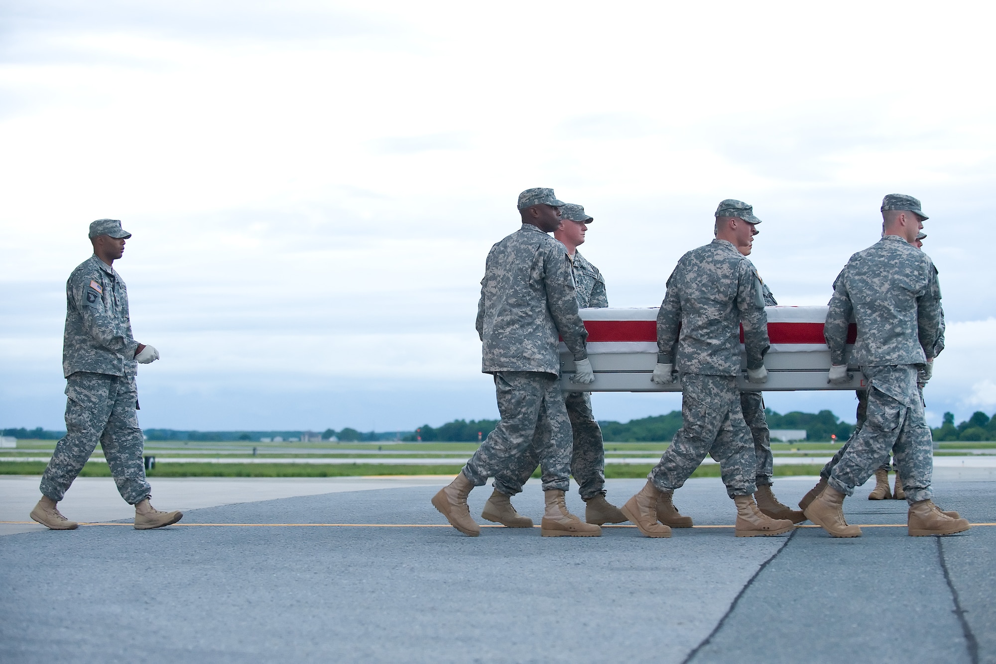 A U.S. Army carry team transfers the remains of Army Spc. Gerardo Campos of Miami, Fla., at Dover Air Force Base, Del., June 4, 2012. Campos was assigned to the 4th Battalion, 23rd Infantry Regiment, 2nd Stryker Brigade Combat Team, 2nd Infantry Division, Joint Base Lewis-McChord, Wash. (U.S. Air Force photo/Adrian R. Rowan)