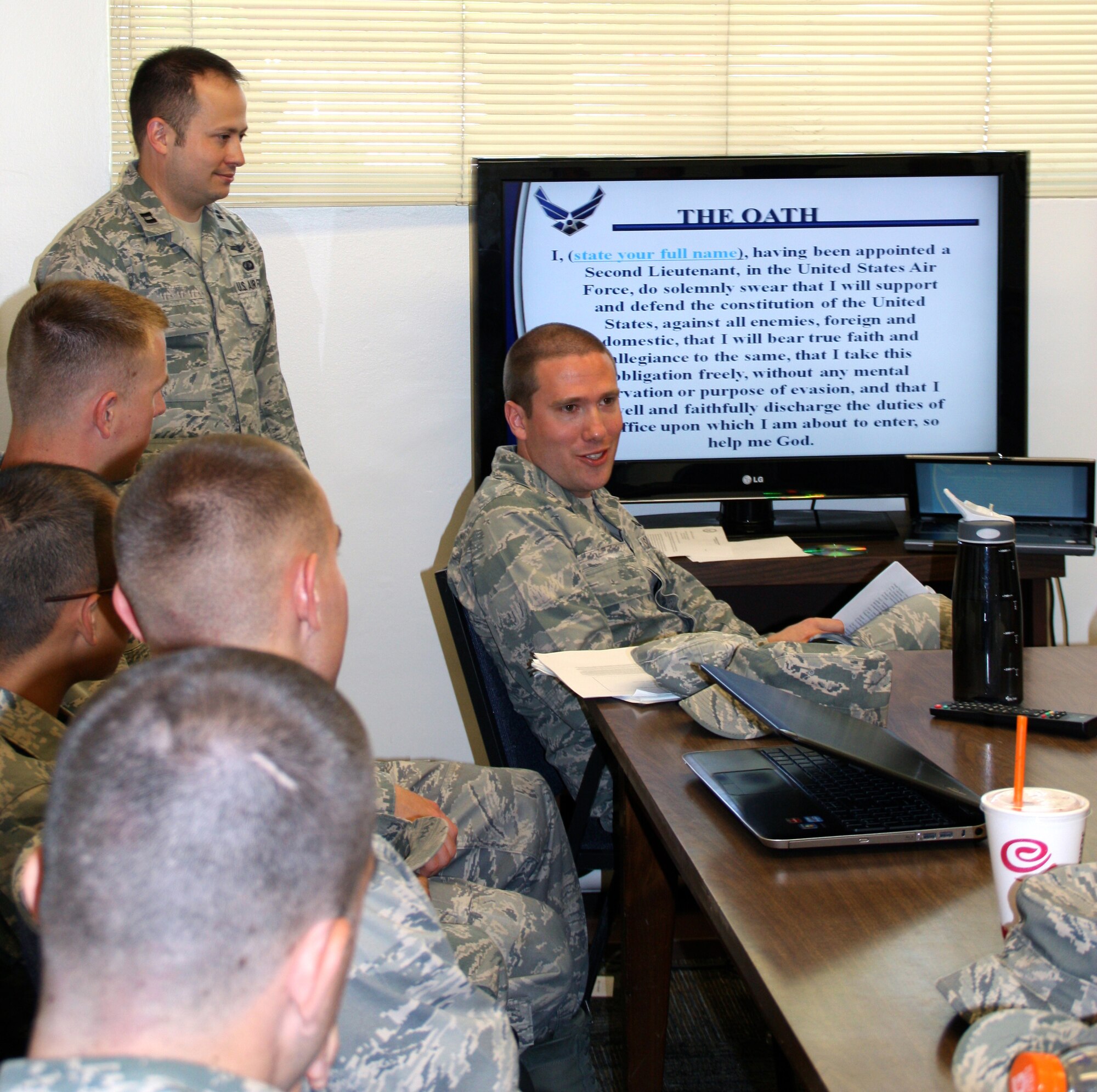 Capt. Richard, 13th Intelligence Squadron, speaks to Sacramento State Air Force ROTC cadets about the Air Force Commissioning Oath May 2, 2012 at the university campus in Sacramento, Calif. Cadets were briefed on the Air Force Code of Conduct, Airman's Creed, and the Commissioning Oath. (U.S. Air Force courtesy photo. This image has been altered for operational security)